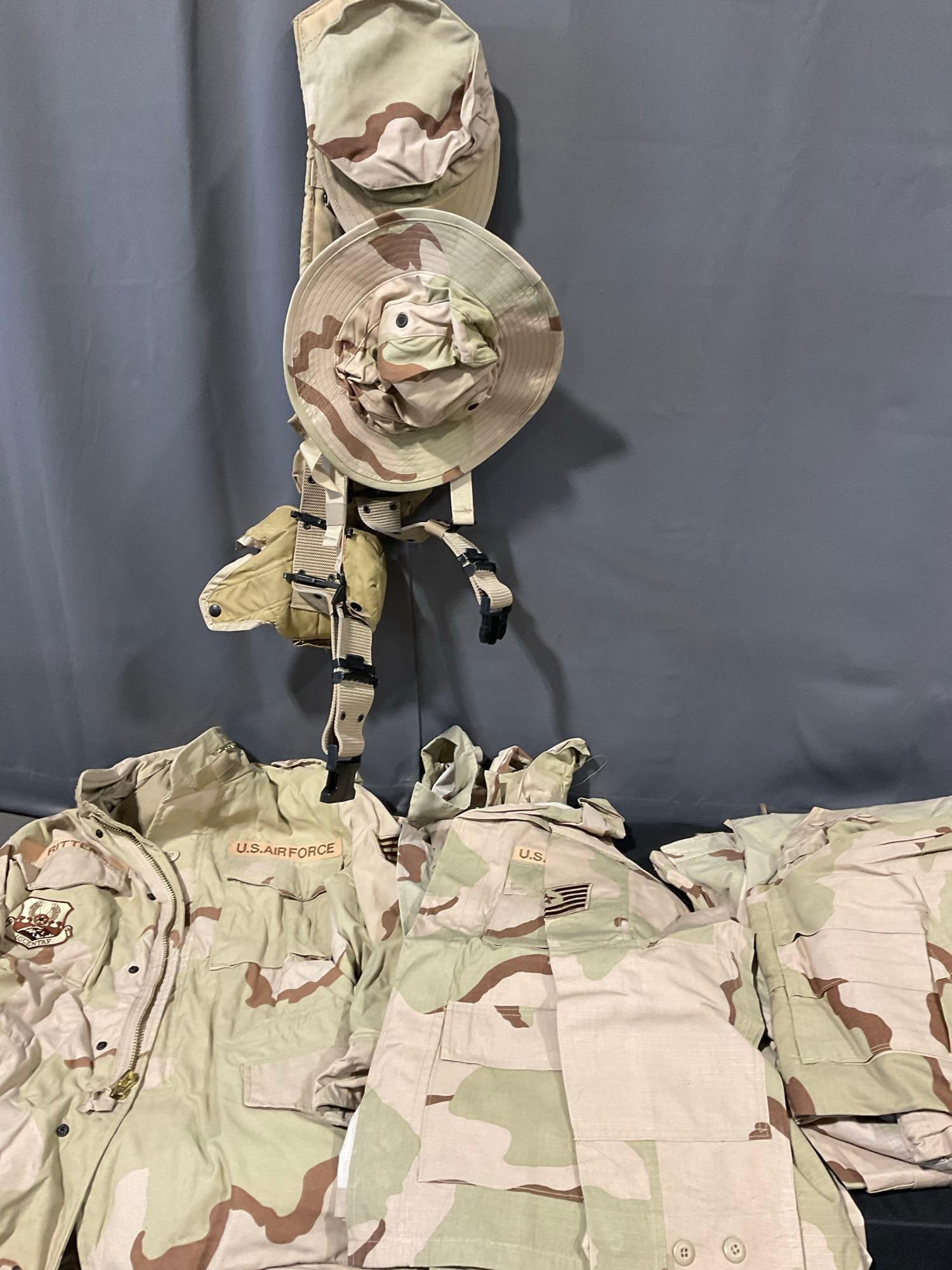 Assortment of Desert Camo MilSurp, 2 Hats, 3 Cold Weather Coats Size Medium Regular & 4 Trousers: Appears to be in good shape. The pieces are in a tub that measures approx 16h x 31w x 21d inches. See pics. E-5600