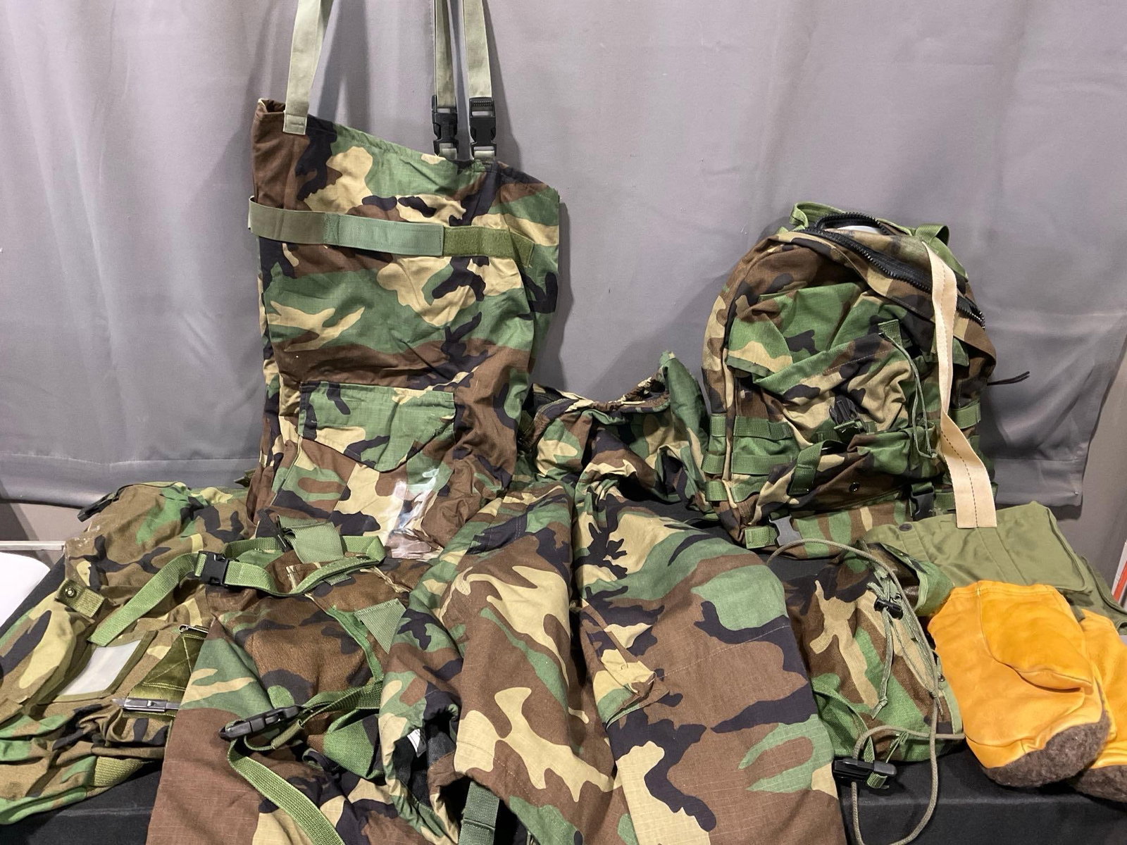 Woodland Camo NFR Overgarment Pants, Arctic Mittens M-1949, Patrol Pack: Appears to be in good shape. The piece measures approx 16h x 24w x 19d inches. See pics. E-5600