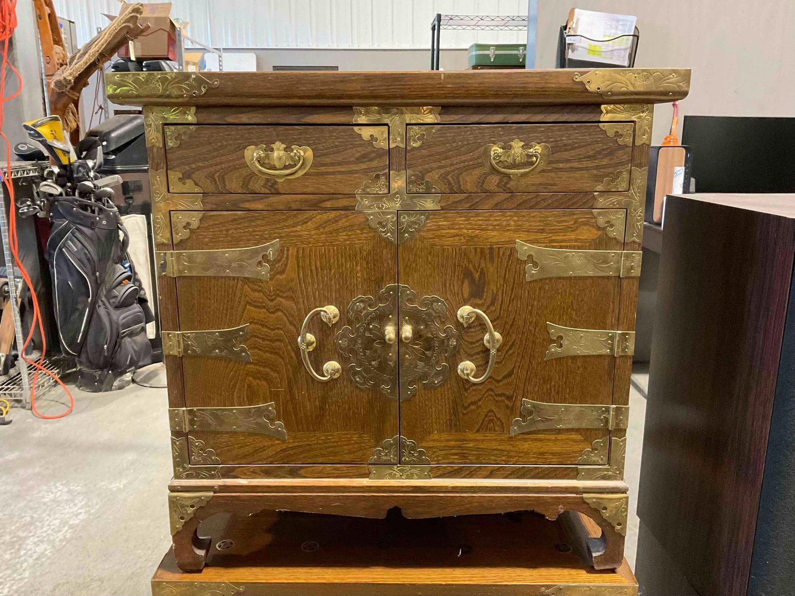 Vintage Asian Style Wood Storage Cabinet w/ 2 Drawers, Cupboard & Coin Detail. See pics.: Vintage Asian Style Wood Storage Cabinet w/ 2 Drawers, Cupboard & Coin Detail. Twin to lot 135. Minor wear indicative of age and use, condition is otherwise very good. Measures 24" x 18" x 24" DM-
