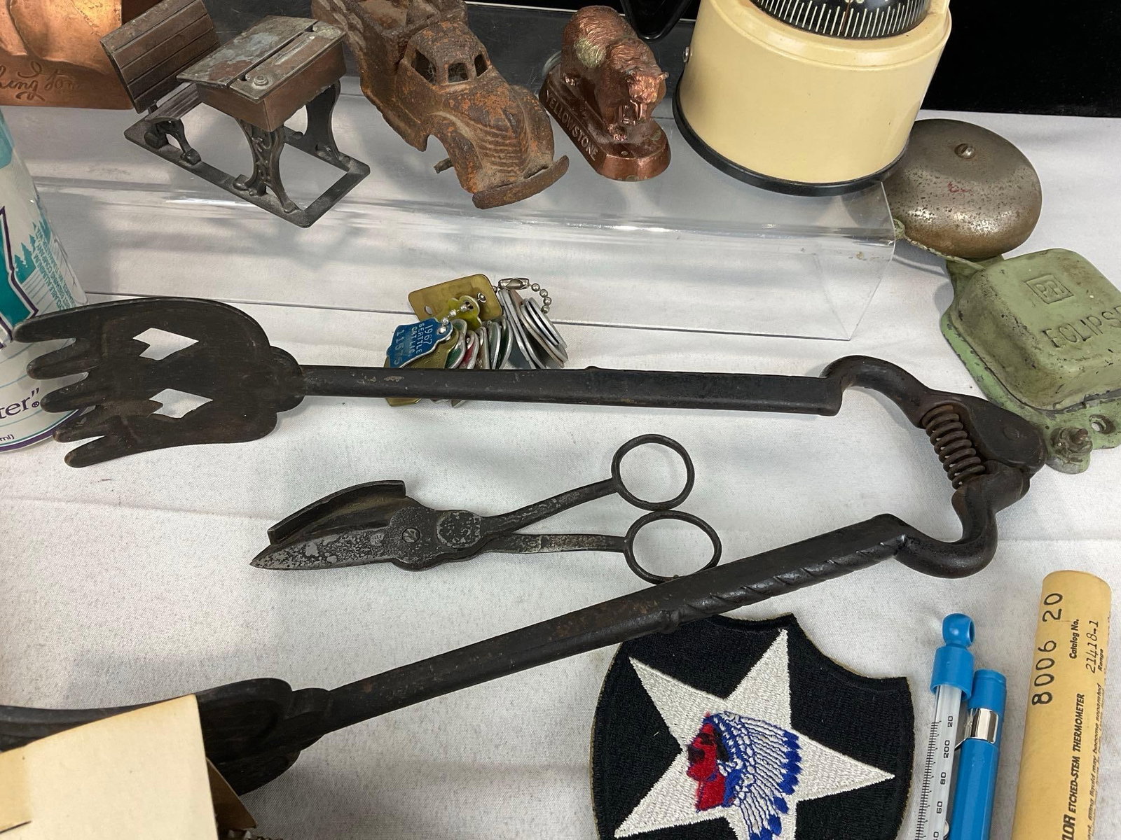 Tongs, Coin Bank, Paper Nativity, Compass, Vintage Bottle Caps, 1940s Work Light, Alarm Bell & more - 4
