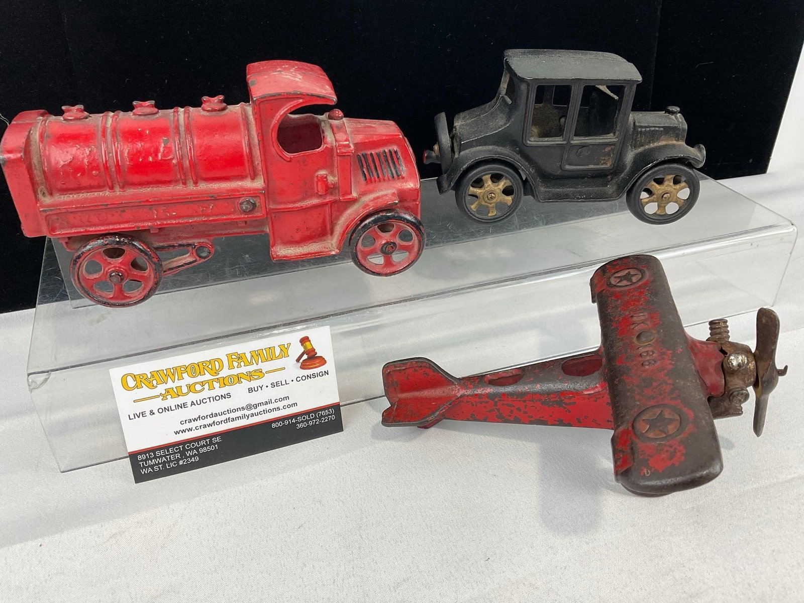 Cast Iron Toys, Red Hubley Fire Truck, Black Model T Coupe, & Red Plane - 4