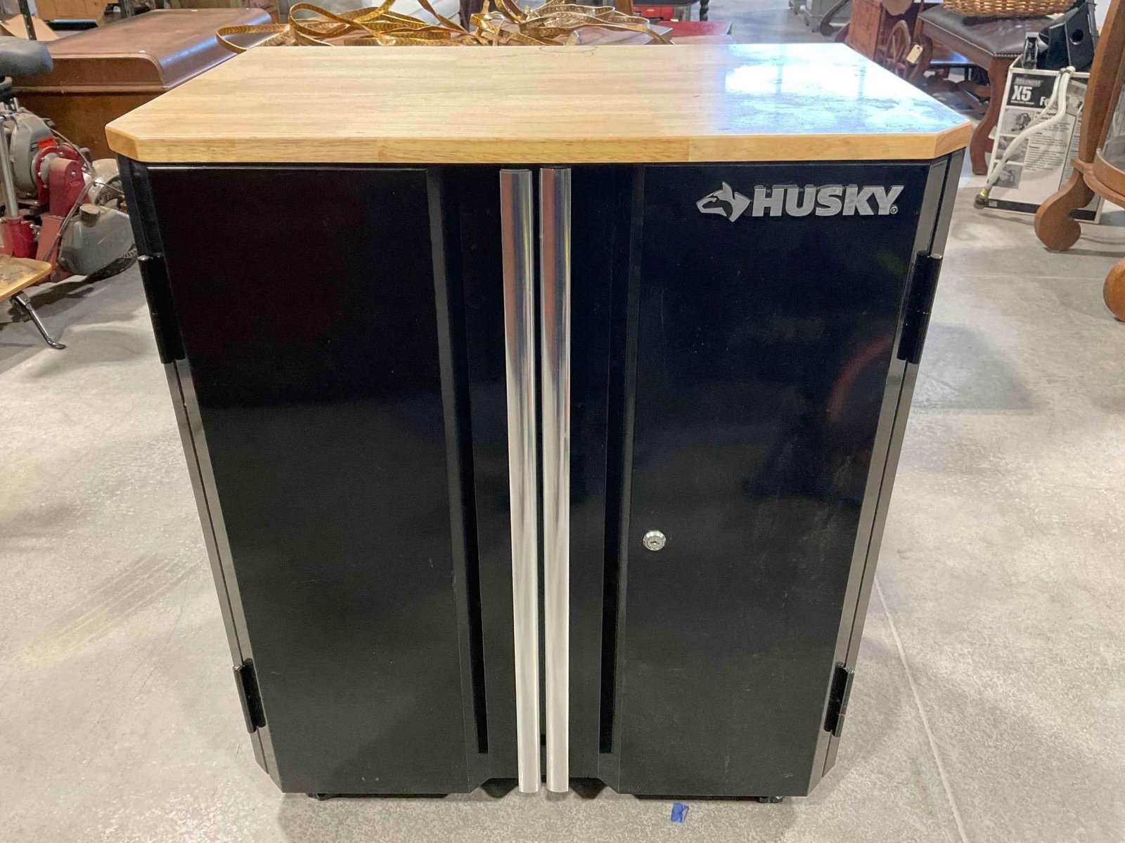Husky Ready to Assemble 24g Steel 2-Door Garage Base Cabinet w/ Black w/ Wood Top.: Husky Ready to Assemble 24g Steel 2-Door Garage Base Cabinet w/ Black w/ Wood Top. No keys. Minor wear indicative of use, otherwise looks to be in good condition. Measures 28" x 19" x 33" DM-6040 