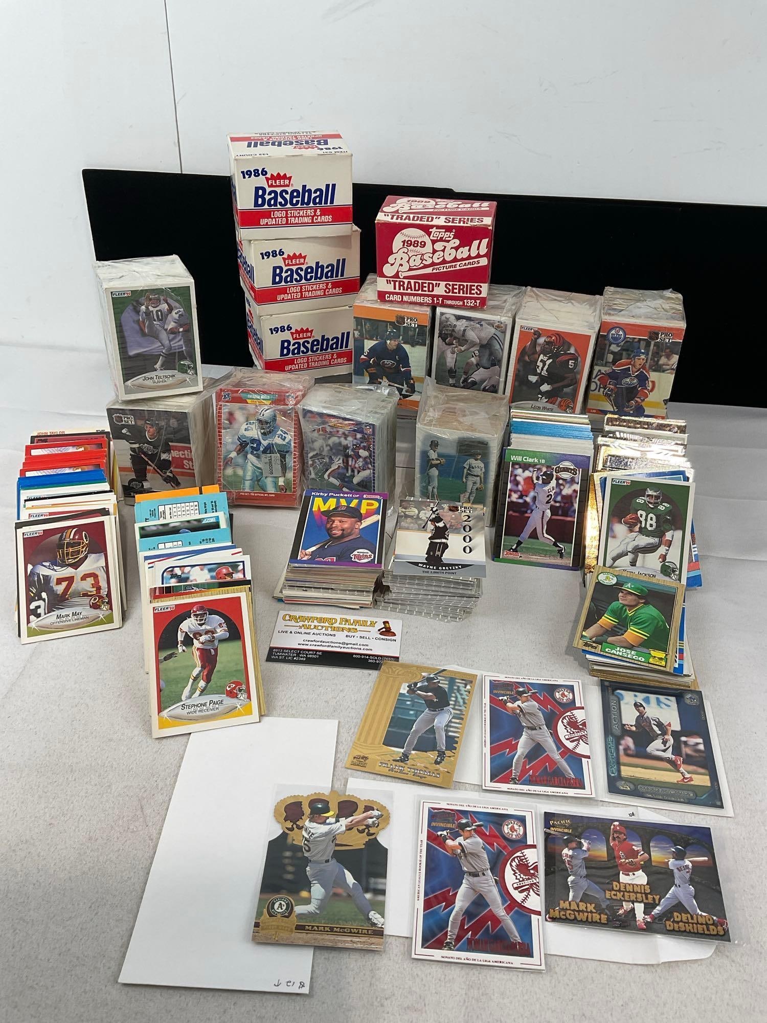 Assorted Sports Cards, 10 Wrapped blocks of Cards, Few in sleeves, few 1986 Fleer boxes: Appears to be in good shape. The piece measures approx 8h x 15w x 12d inches. See pics. E-5940