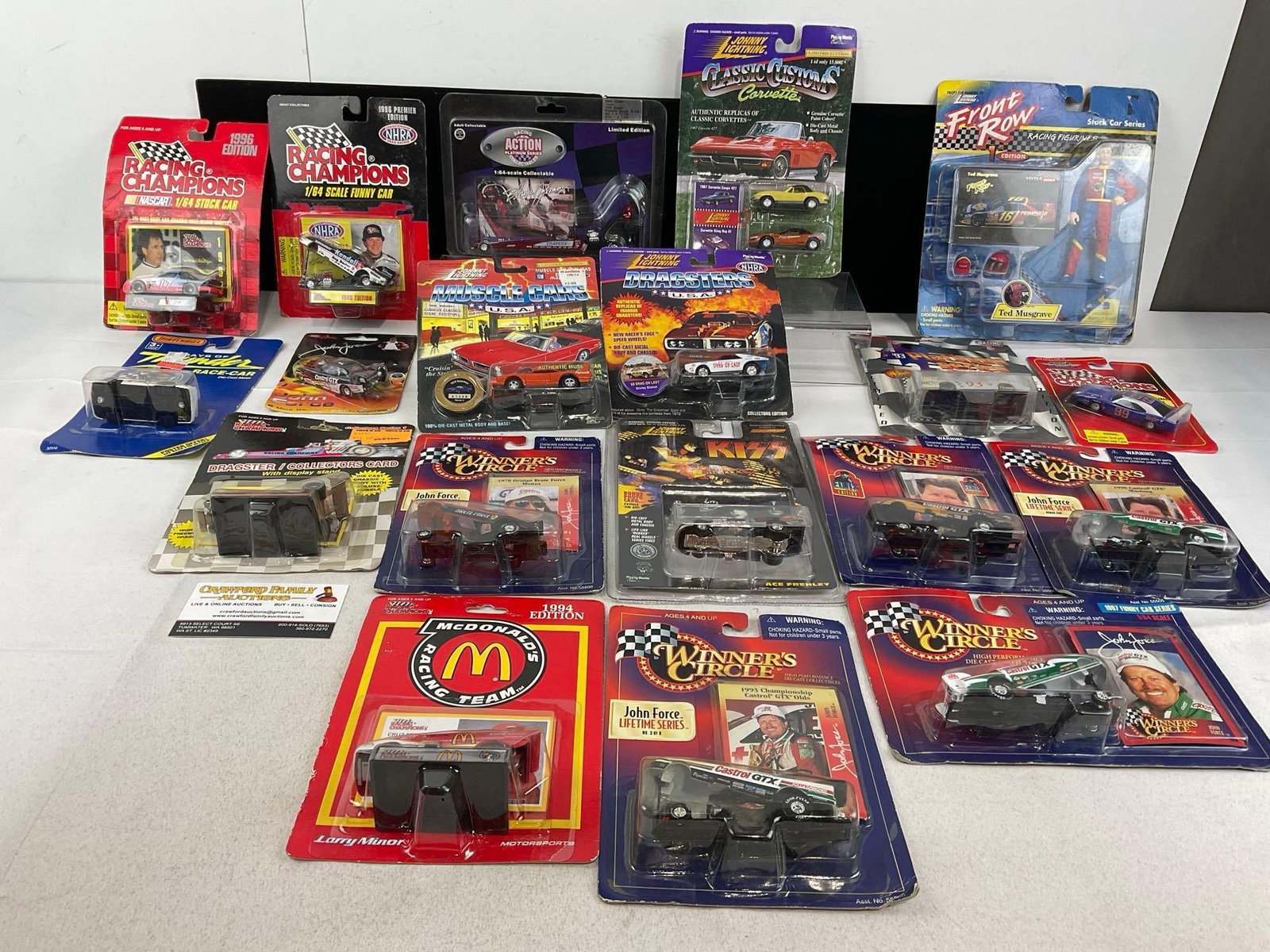 18 Diecast Cars, in packaging, Racing Champions, Johnny Lightning, Winners Circle, Drag & Stock C...: Appears to be in good shape. The piece measures approx 9h x 17w x 14d inches. See pics. E-5940