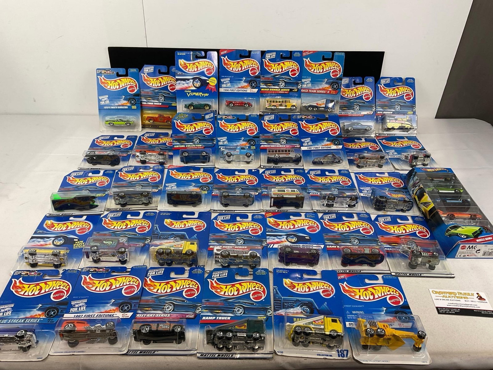 Set of 40 Hot Wheels Diecast Cars in packaging, from all kinds of sets: Appears to be in fair to good shape, some shelf wear to the pieces. The piece measures approx 7h x 12w x 12d inches. See pics. E-5940