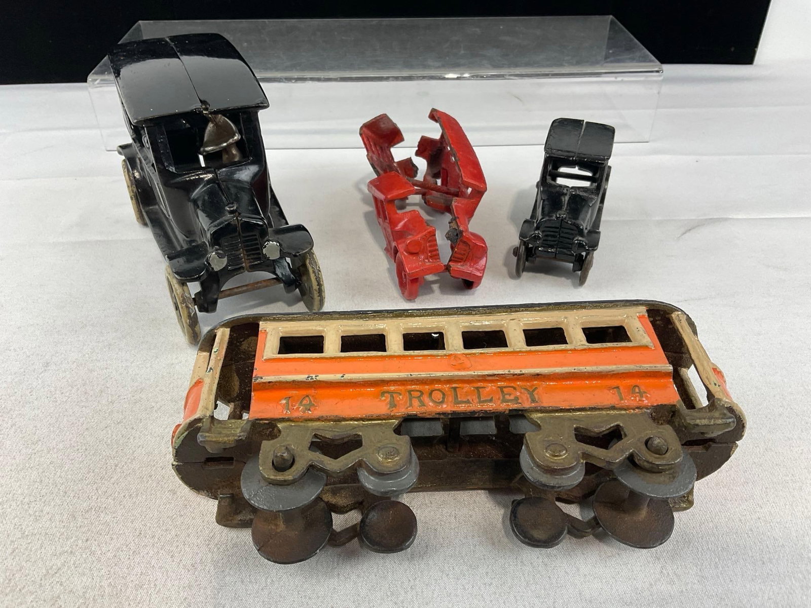 3Cast Iron Toys, Arcade Ford Model T, Bus w/breaks, & Smaller Hubley? Model T, & Tin Trolley Figure - 2