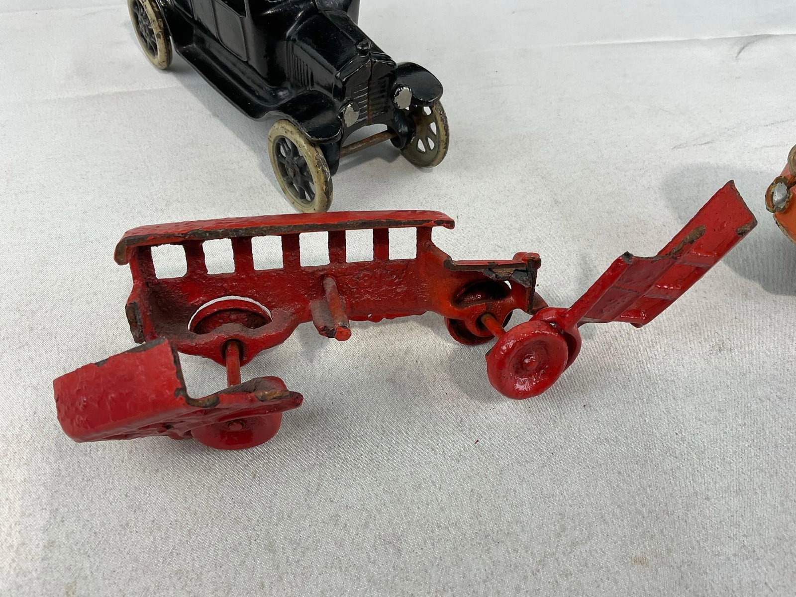 3Cast Iron Toys, Arcade Ford Model T, Bus w/breaks, & Smaller Hubley? Model T, & Tin Trolley Figure - 3