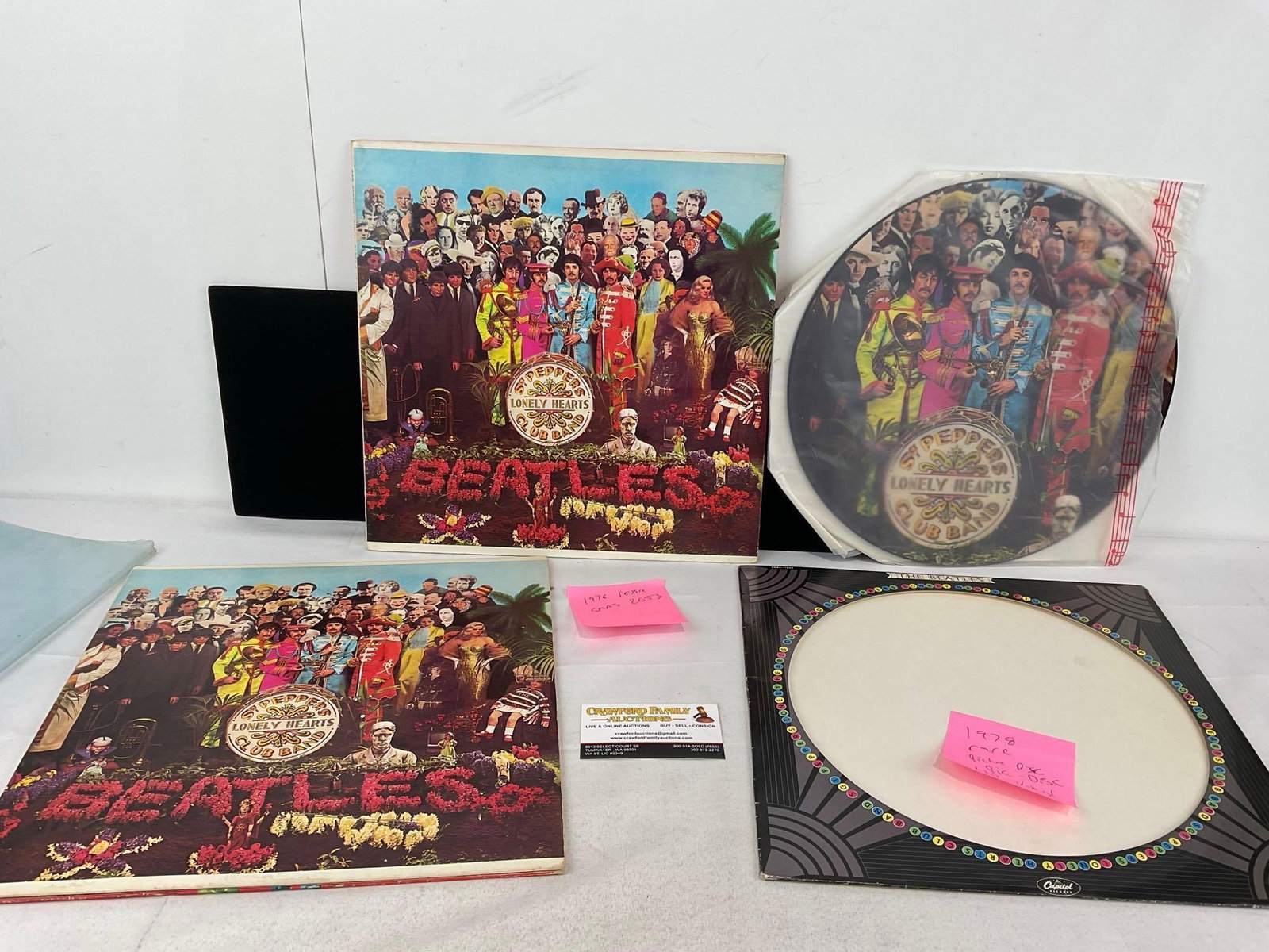 Trio of Beatles Vinyl Records, All Sgt. Peppers Lonely Hearts Club Band, 1 Pic Disc Full art record: The pair appear to be reissues, matching ones are 1976, & the other from 1978, we are not experts on records. Appears to be in good shape. The piece measures approx 2h x 14w x 14d inches. See