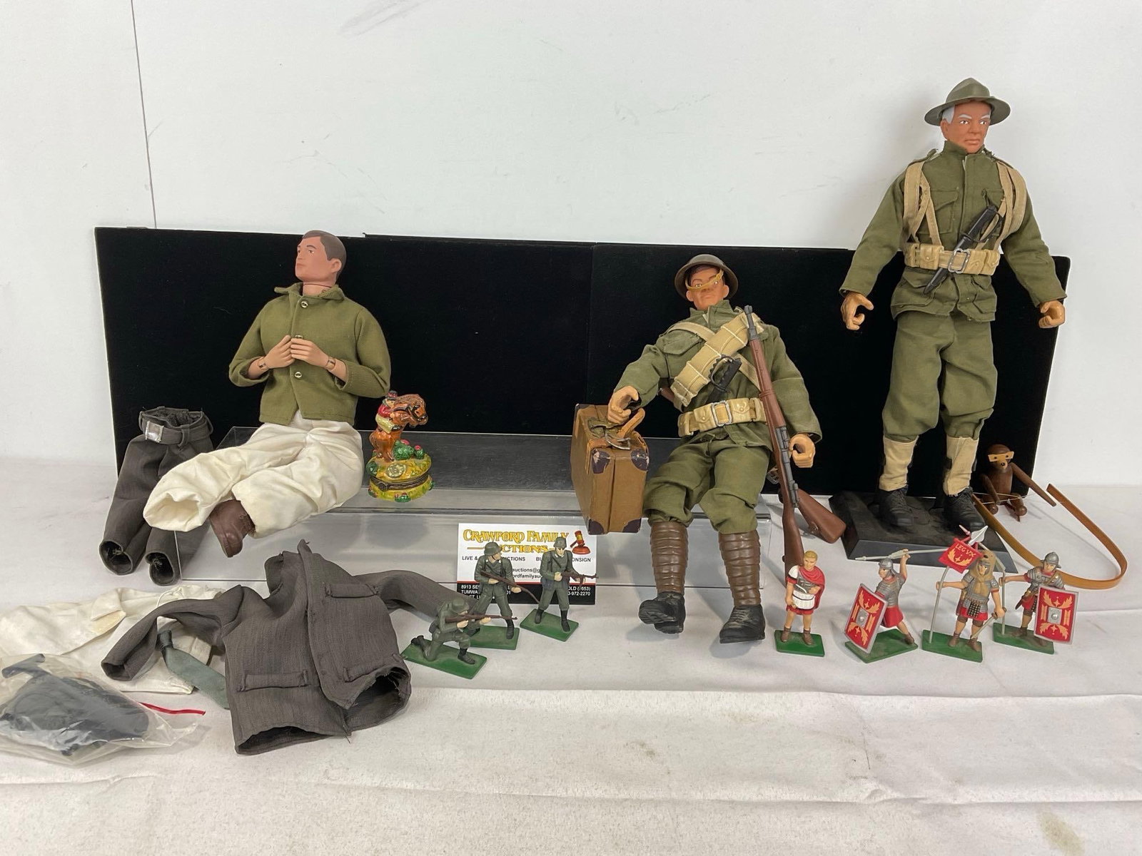 3 WW2 Action Figures Formative Intl w/clothes, 7 Blue Box WW2 & Roman Figures, 9x13x9 inches: Appears to be in good shape, one figure is missing a leg, the small figures have some wear. The piece measures approx 9h x 13w x 9d inches. See pics. E-5360