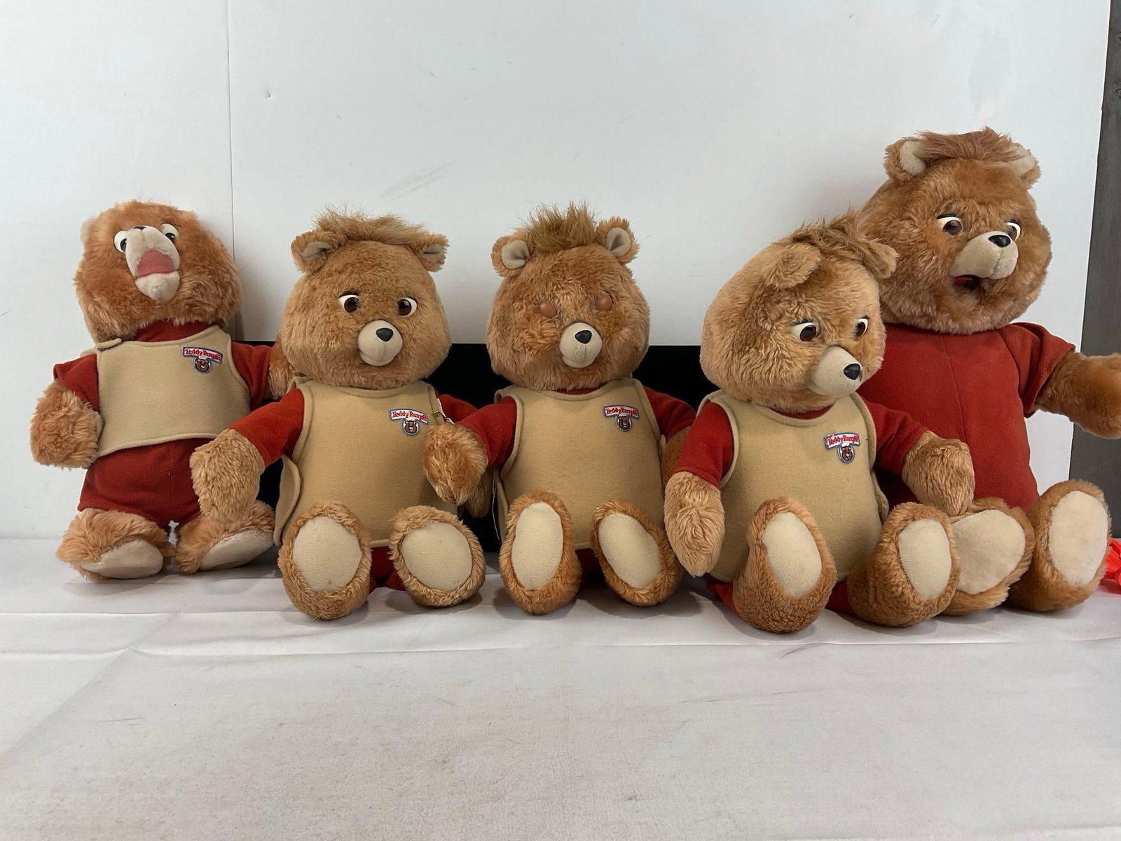 5 Teddy Ruxpin Bear Toys, 3 smaller, 1 larger, 1 totally plush, 1 w/Cassette Player & 3 w/cartrid...: Appears to be in fair to good shape, the electronics are untested, assumed working. The pieces fit in a a tub that measures approx 11h x 19w x 17d inches. See pics. E-5950