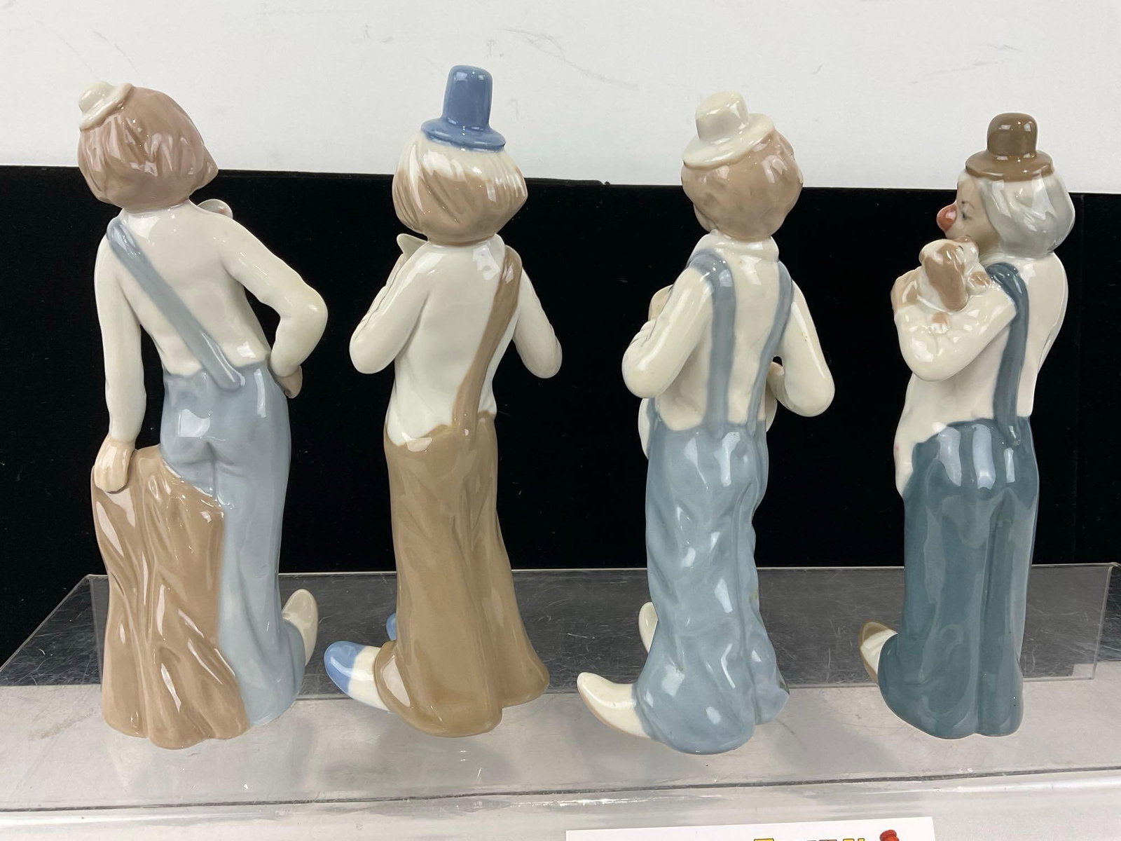 Set of 4 Casades Porcelain Clown Figurines, approx 6 inches tall each - 4