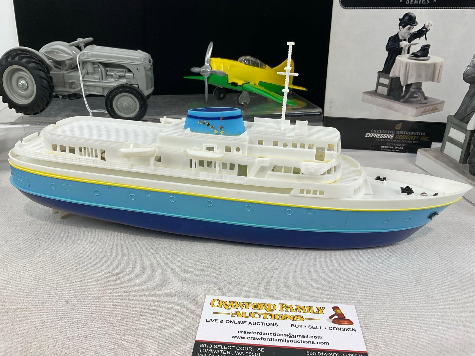 Alaska Marine Ferry, Hubley Folding Plane, 1985 Ford 9N Tractor, Charlie Chaplin Porcelain Statue - 3