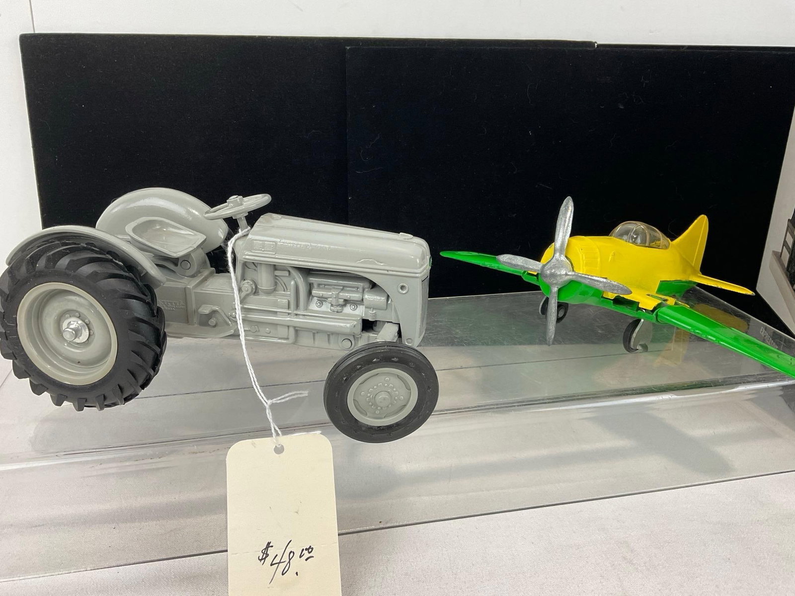 Alaska Marine Ferry, Hubley Folding Plane, 1985 Ford 9N Tractor, Charlie Chaplin Porcelain Statue - 6