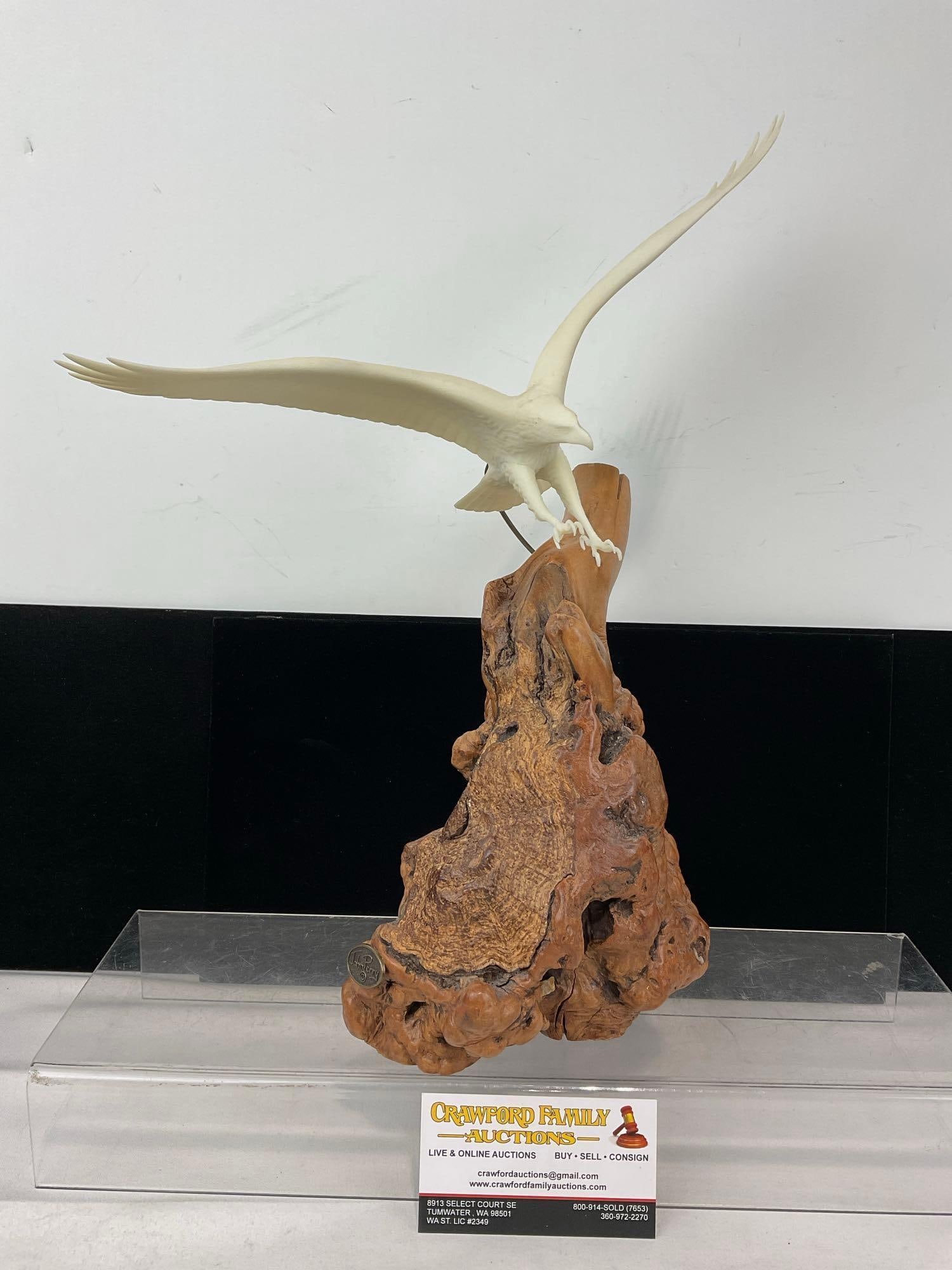Carved Pellucida Eagle Sculpture on Burlwood Stand, by John Perry, 16x13x7 inches: Same artist for the next couple pieces. Appears to be in good shape. The piece measures approx 16h x 13w x 7d inches. See pics. E-6080