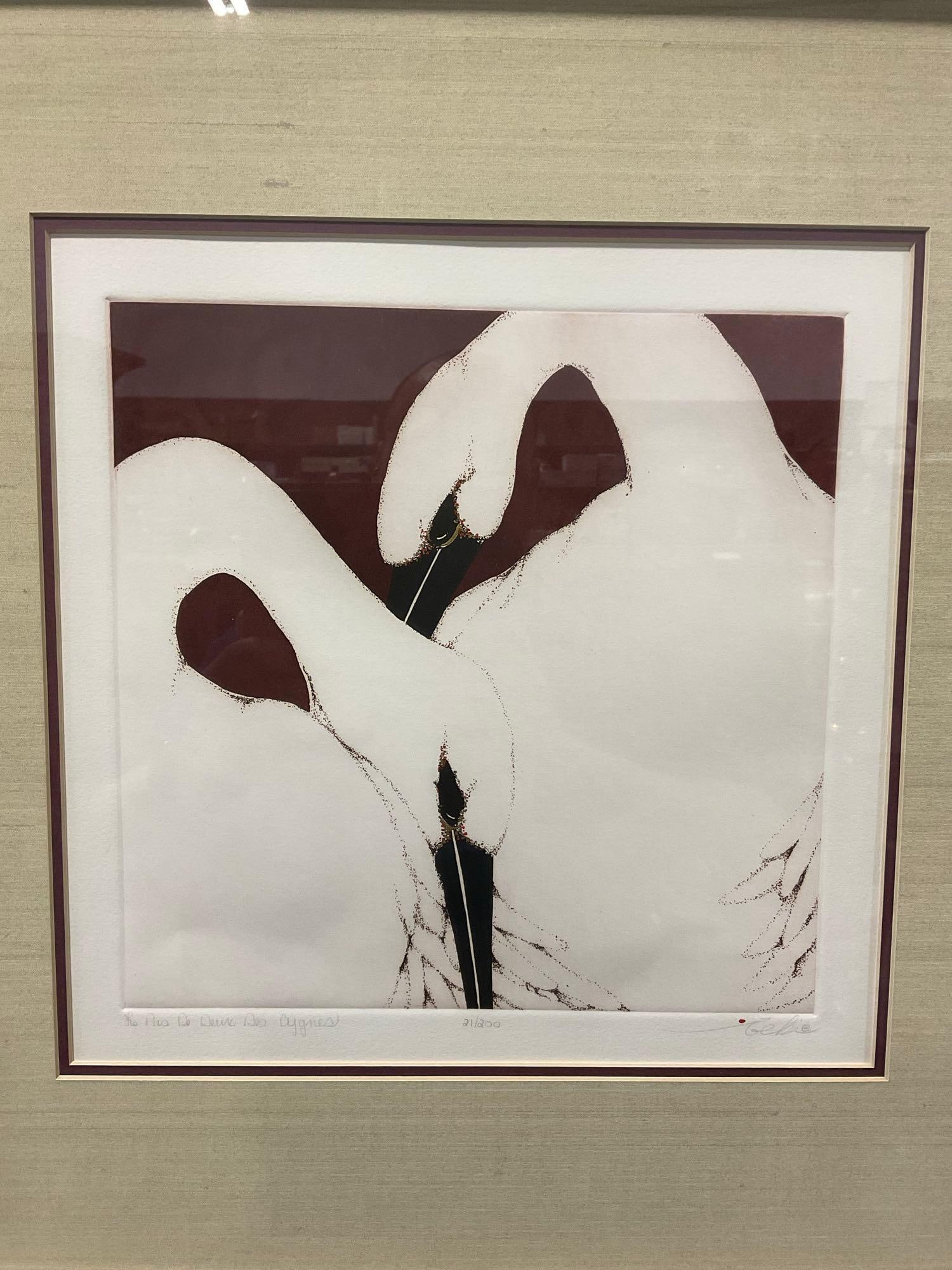 Framed Signed & #d 21/200 titled Le Plus de Deux Des Cygnes by Beki Killorin, 22h x 22w x 3d inches: In a matching styled set of signed lithographs, this is two swans, titled signed & numbered in the lower margin. Appears to be in good shape. The piece measures approx 22h x 22w x 3d inches.