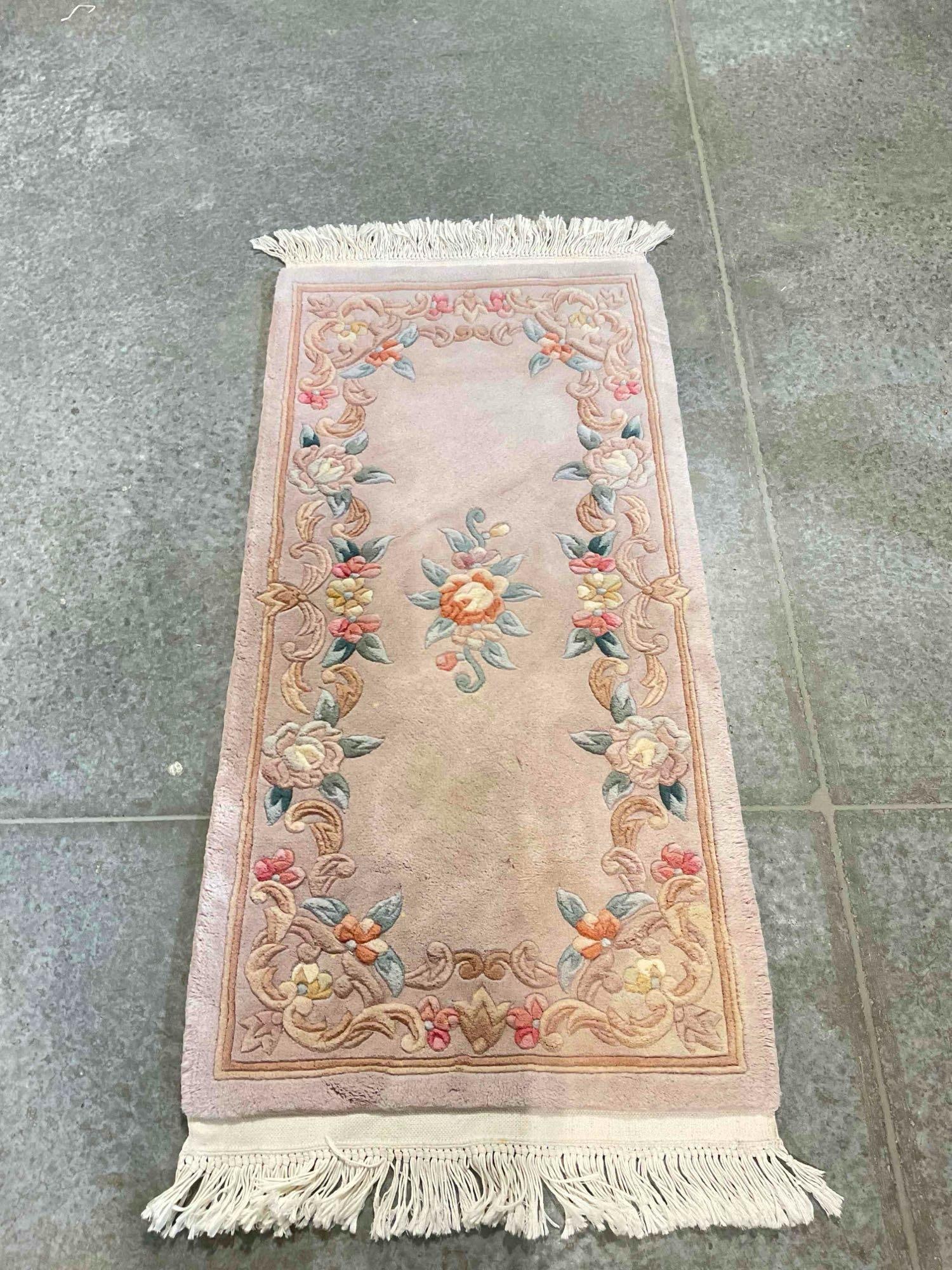 Vintage Mauve Wool Pile Area Rug w/ Floral Border. Fair Condition. Measures 56" x 25" See pics.: Vintage Mauve Wool Pile Area Rug w/ Floral Border. Fair Condition. Has been stained and cleaned, cleaner looks to have contained bleach, otherwise looks to be in fair condition. Measures 56" x 25" x