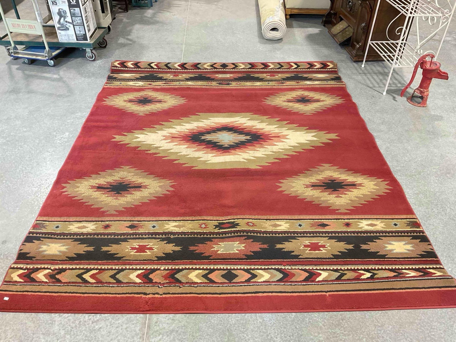 Home Decorators Red & Brown Nylon Pile Area Rug w/ Southwestern Design. Measures 120" x 94": Home Decorators Red & Brown Nylon Pile Area Rug w/ Southwestern Design. Good Condition. Measures 120" x 94" x 1" Minor wear indicative of age and use, otherwise looks to be in good condition.