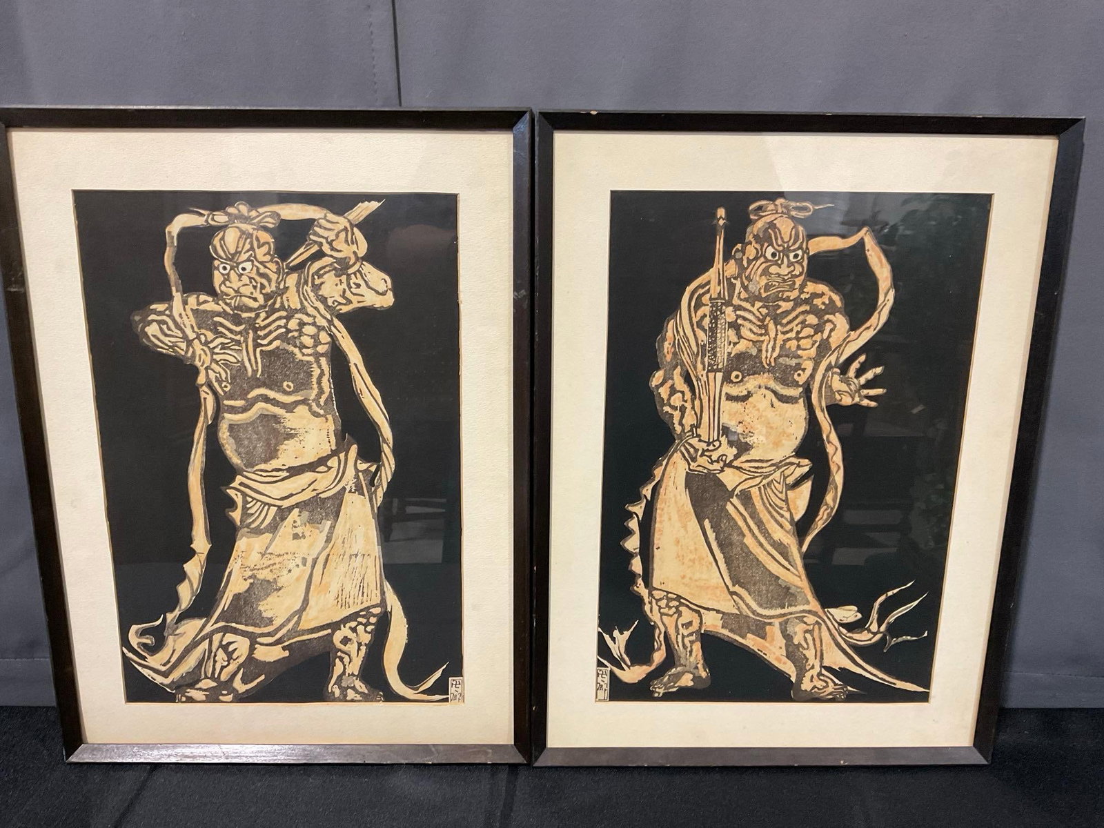 Pair of Framed Japanese Woodblock Prints, Asaka Manjiro, 2 Guardian Deities, Black background: Appears to be in good shape. The piece measures approx 20h x 15w x 3d inches. See pics. E-6080