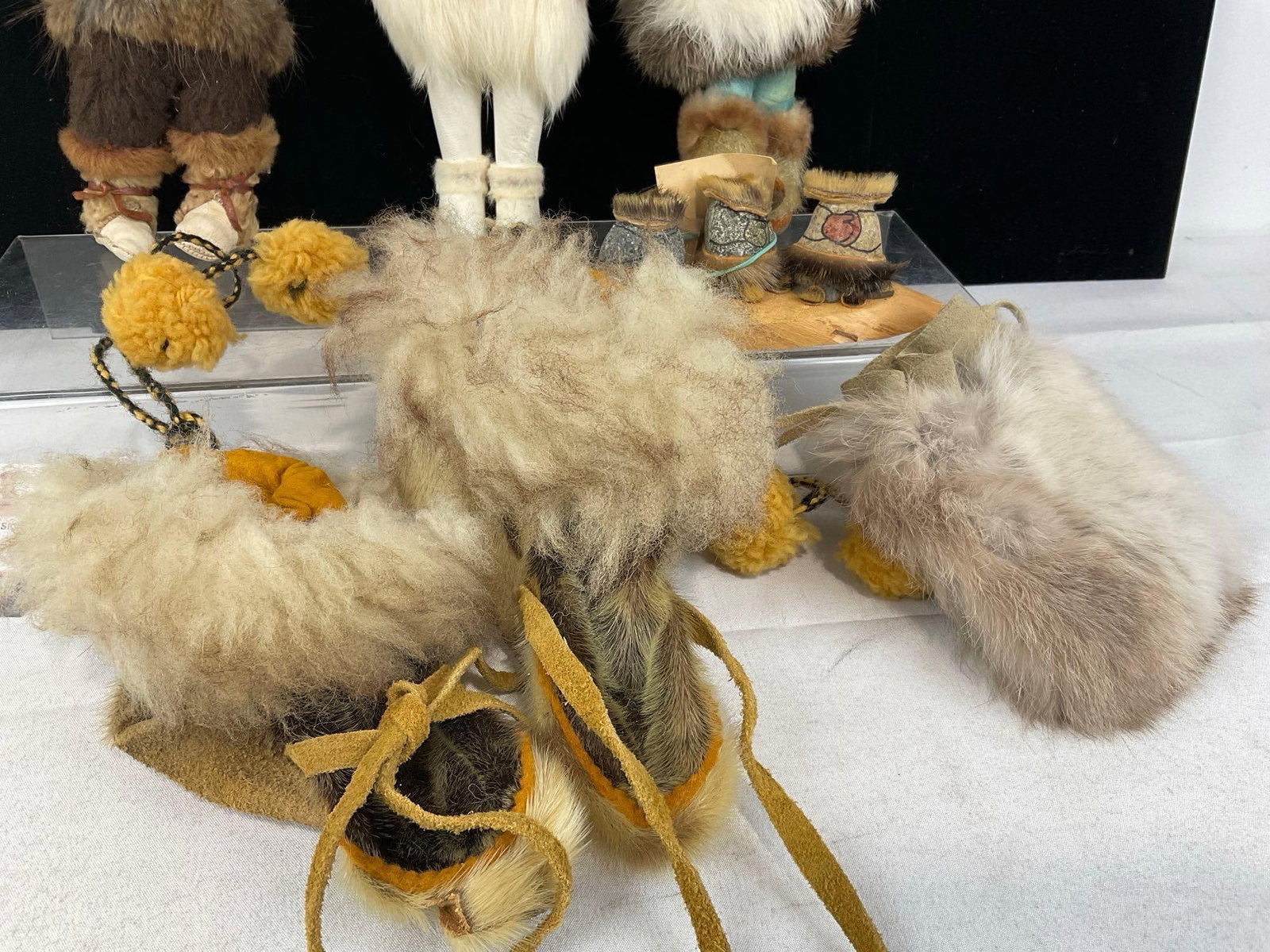 3 Native American Fur & Leather Dolls, Rabbit Fur Bag, & Pair of Moccasins, Rock Statue - 3