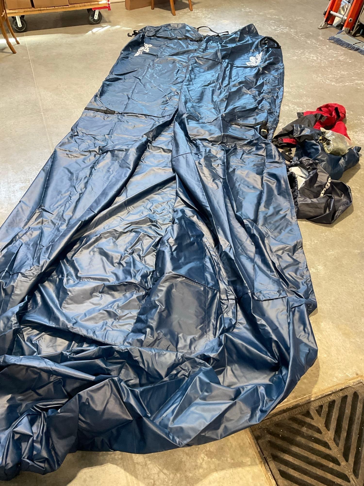 Massive Ranger Boat Cover model Z21, in Navy Blue, roughly 18 x 8 feet coverage, in carrying bag: Similar to the last lot, same model Z21. Appears to be in good shape. The pieces fit in the bag that measures 20h x 25w x 25d inches. See pics. E-5600