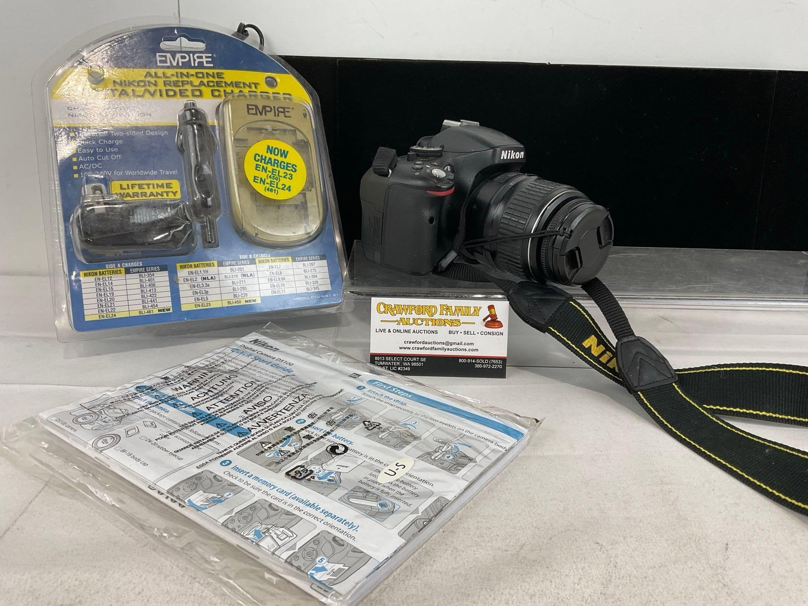Nikon Digital Camera D5100 w/Nikon AF-S DX Nikkor ED18-55mm Lens w/charger, & manual: Tested & working, powers on, shows in pictures. Appears to be in good shape. The piece measures approx 12h x 9w x 10d inches. See pics. E-6020