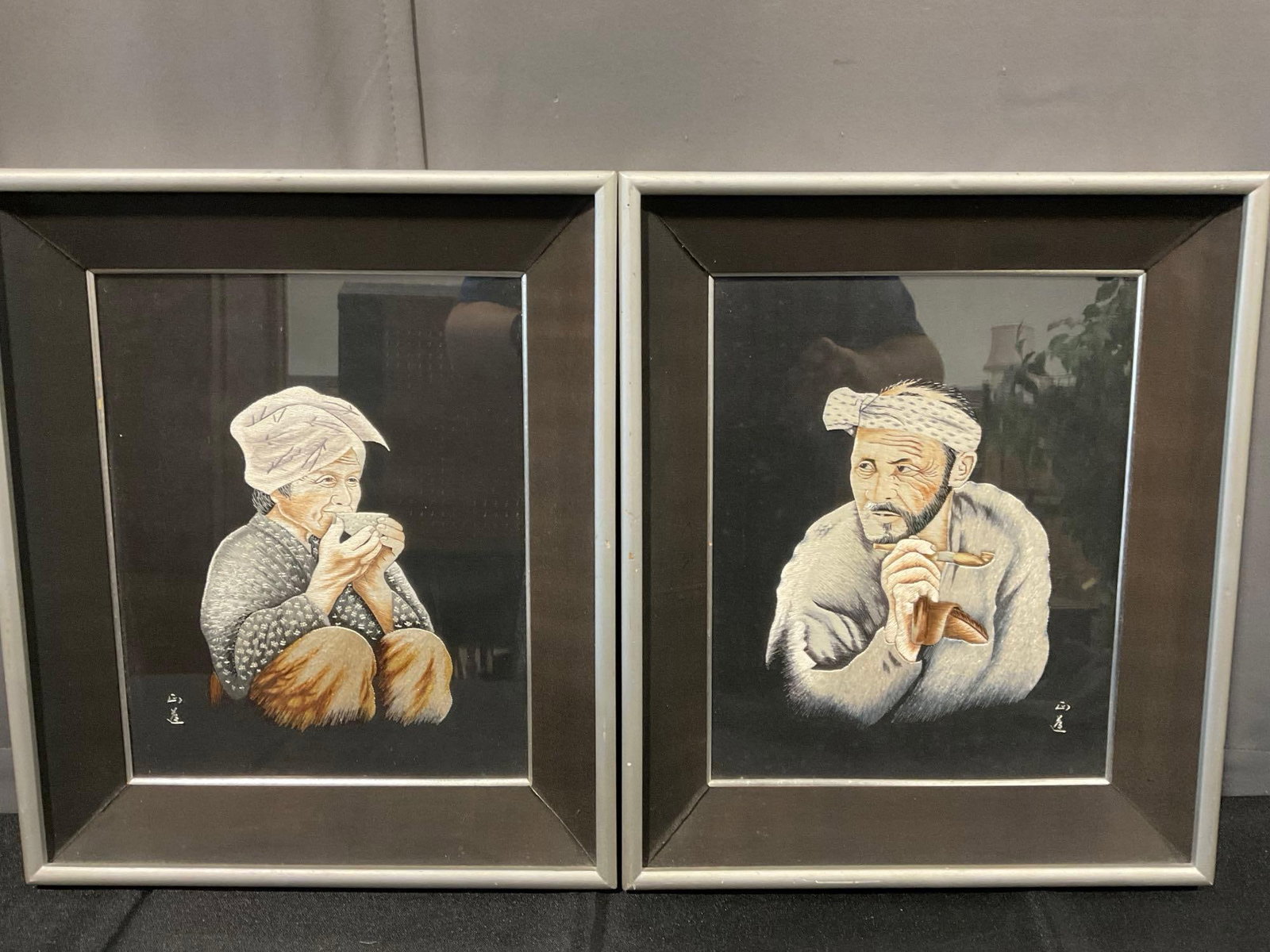 2 Framed Seido Sakamaki Embroidered Japanese Pieces, Woman Sipping Tea & Man smoking a pipe: Appears to be in good shape. The piece measures approx 17h x 14w x 5d inches. See pics. E-6080