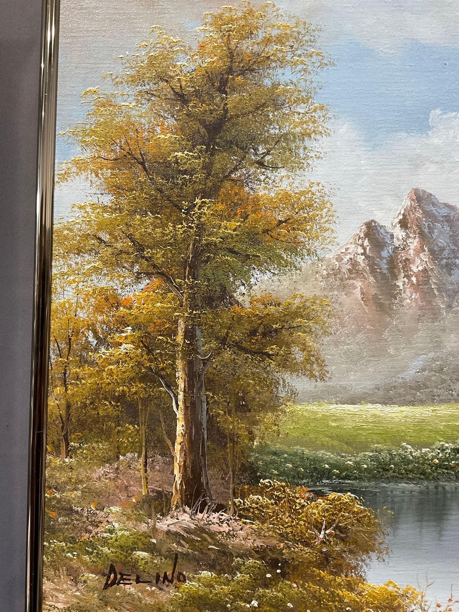 Framed Oil on Canvas, Calm River, w/Mountains in background, signed Delino, 22h x 25w x 3d inches - 2