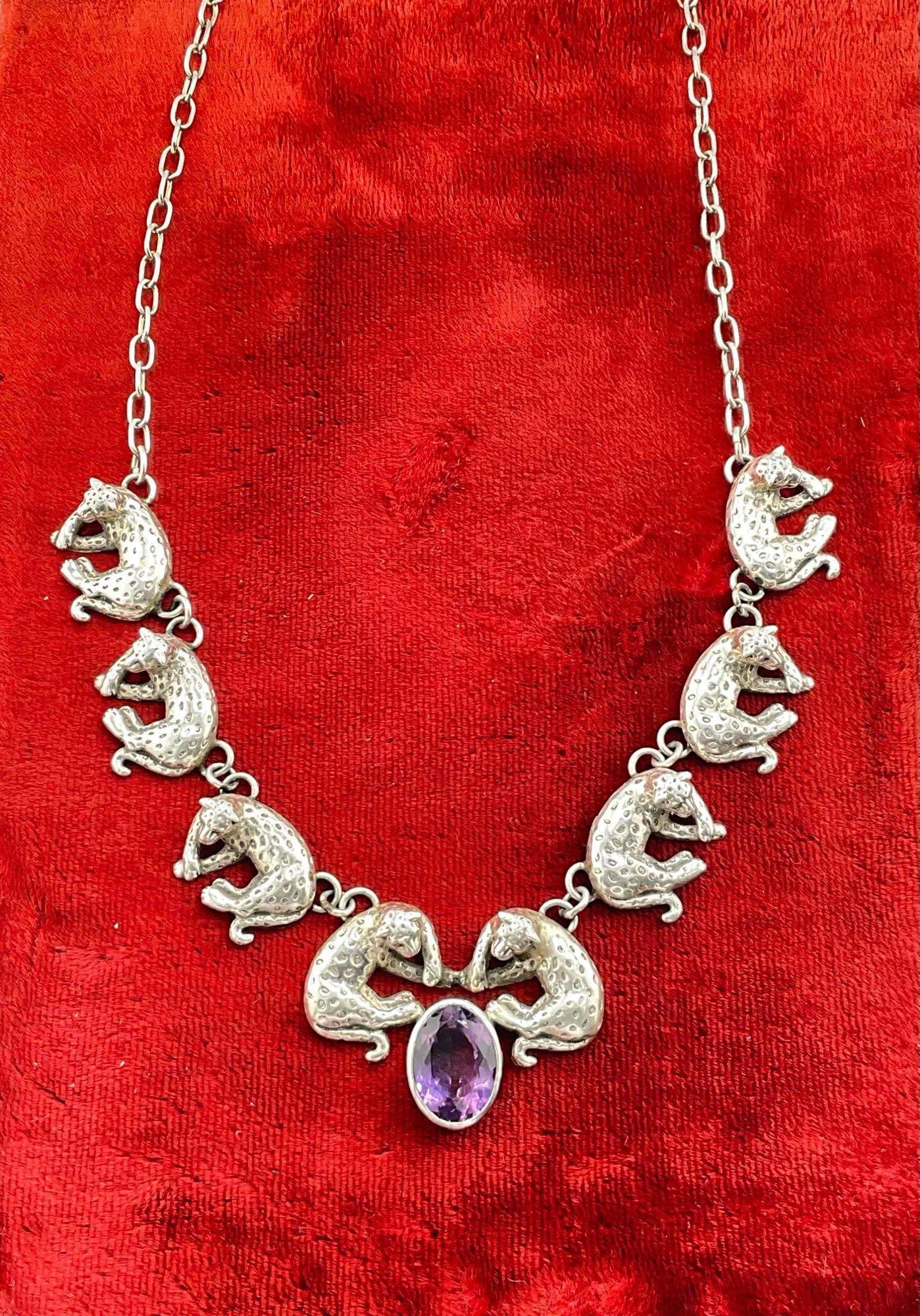 Vintage Carol Felley Sterling Silver Necklace w/ Leopards Design & Amethyst Toned Setting.: Vintage Carol Felley Sterling Silver Necklace w/ Leopards Design & Amethyst Toned Setting. Stamped 90 on reverse. Measures 18.5" from end to end, weighs 48 grams. DM-414