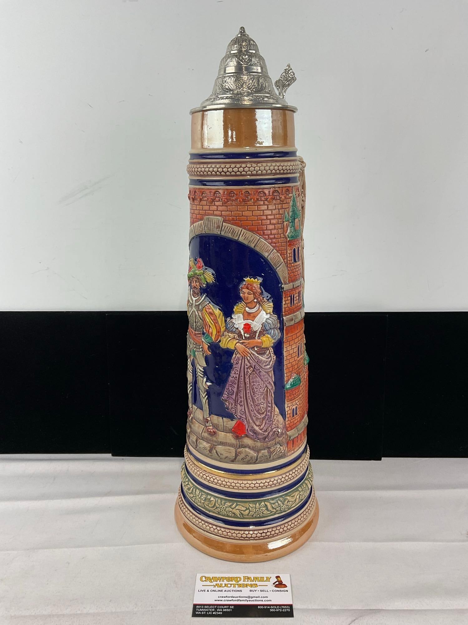 Huge 3 Liter West German Gerz Stoneware Stein, Handpainted High-Relief Lovers Scene: Similar to the next two lots. Appears to be in good shape. The piece measures approx 20h x 8w x 7d inches. See pics. E-6090