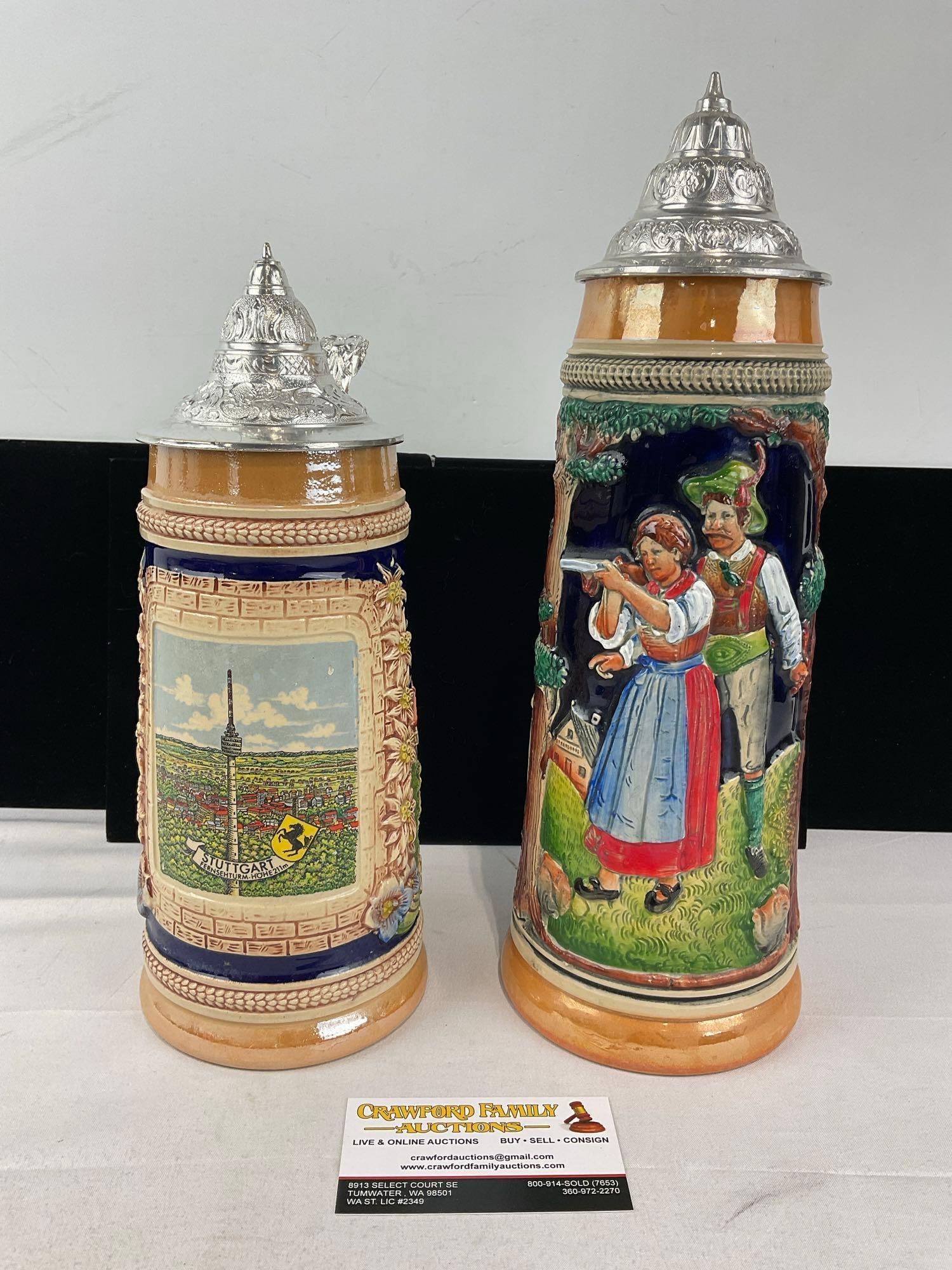Pair of West German Stoneware Steins, w/pewter lids, Stuttgart & Hunting Scene: Appears to be in good shape. The piece measures approx 14h x 10w x 7d inches. See pics. E-6090