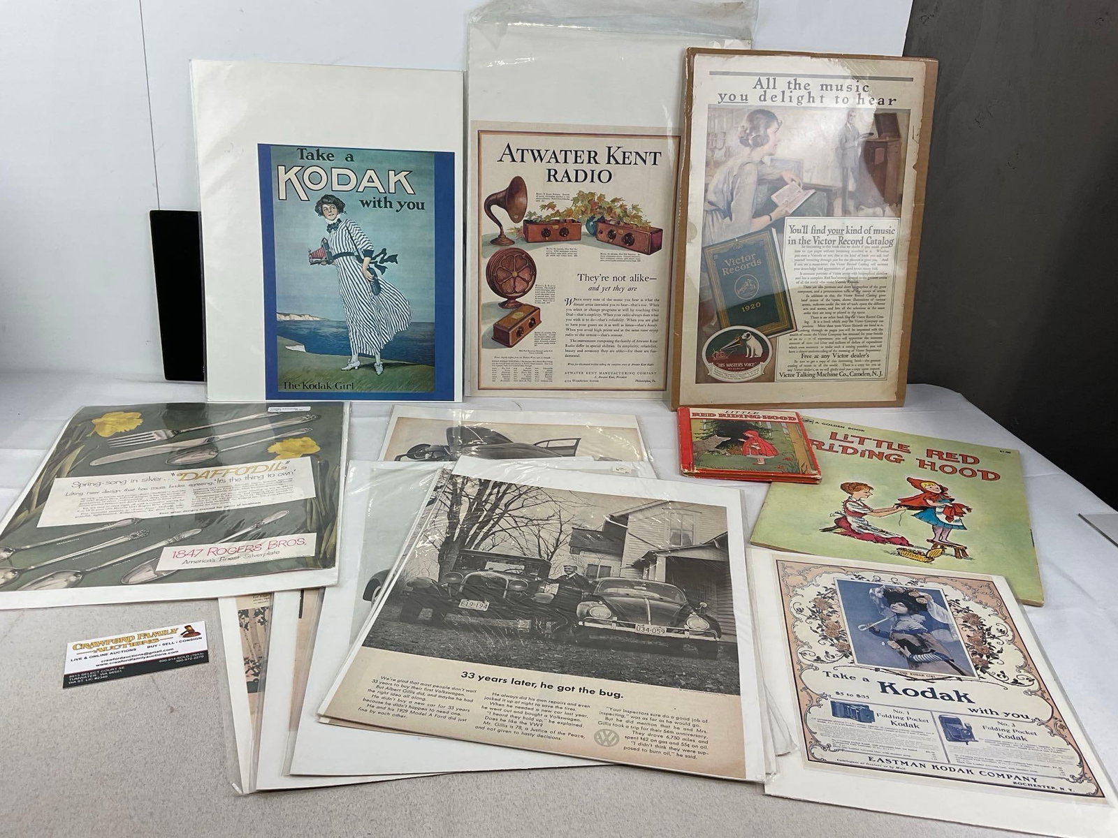 Variety of Magazine Advertisements, Kodak, Volkswagen, Victor Records, 2 Lil Red Riding Hood Books: See pics for the pieces included. Appears to be in good shape. The piece measures approx 3h x 18w x 14d inches. See pics. E-5950