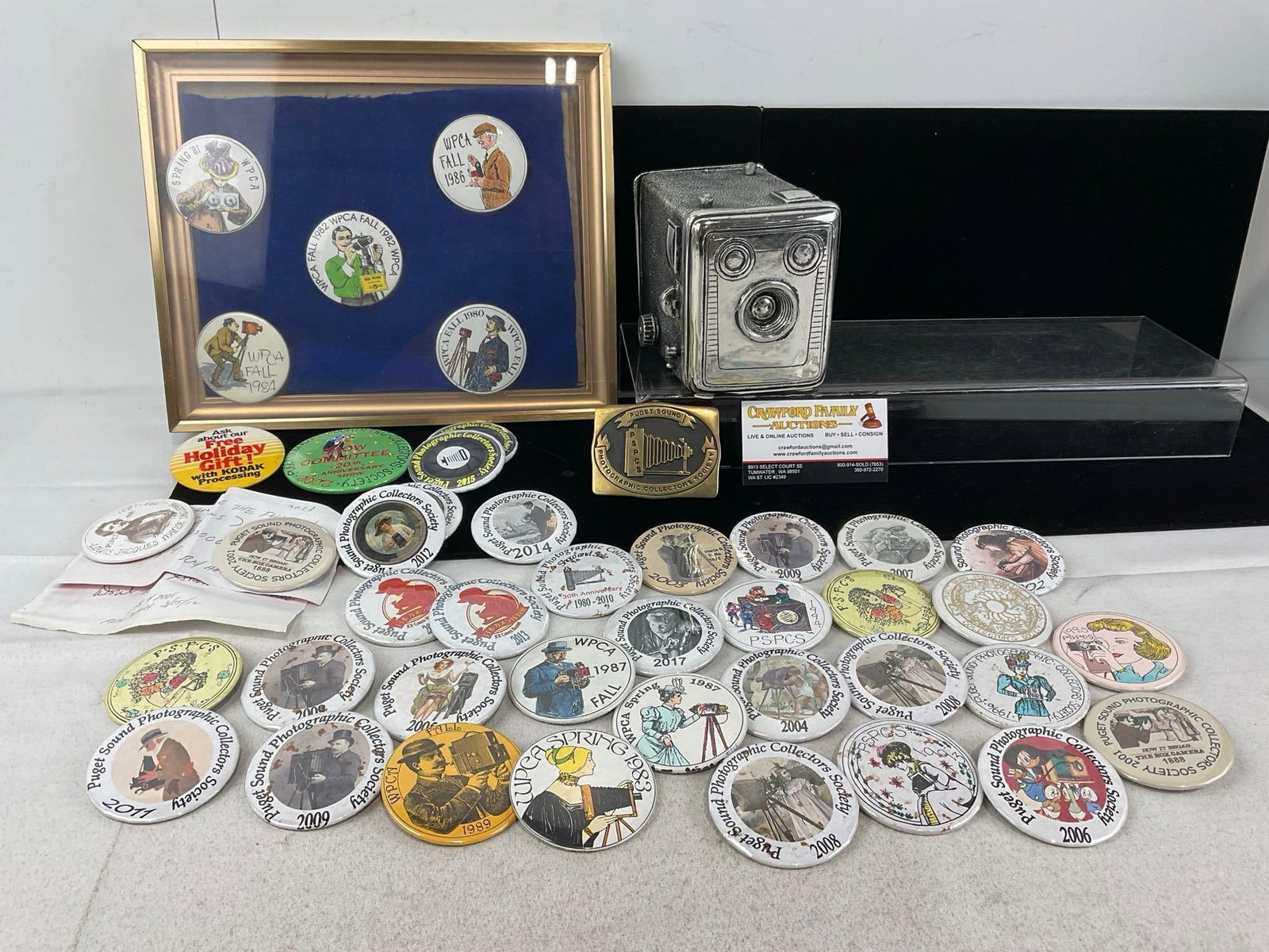 Collection of 43 Puget Sound Photographic Collectors Society Buttons, from around 1980 to 2017: Appears to be in good shape. The piece measures approx 17h x 10w x 6d inches. See pics. E-5950