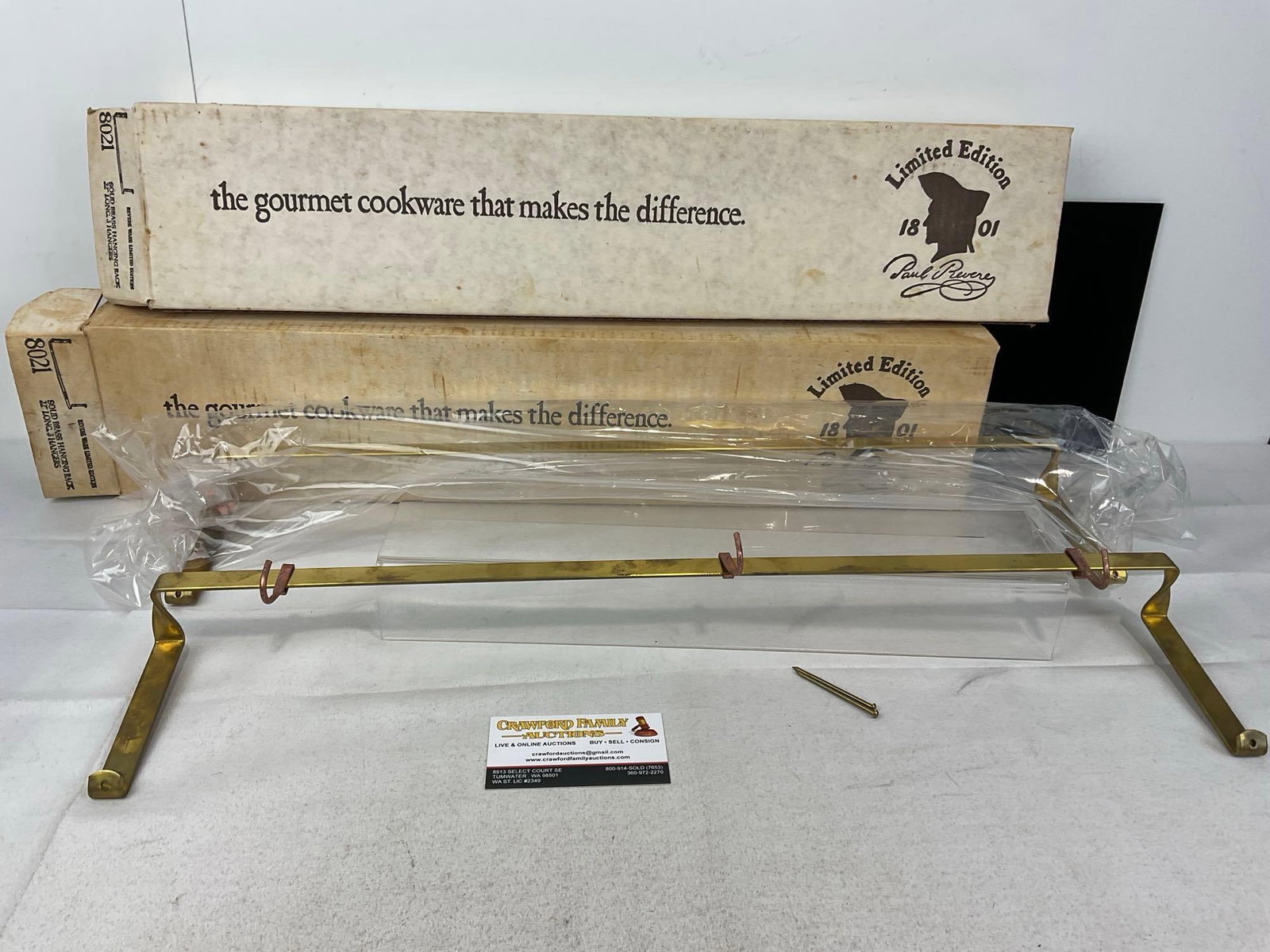 NIB Pair of Revere Ware Solid Brass Hanging Racks, 22 inch long 3 Copper hangers #8021: Appears to be in good shape. The two pieces in box measures approx 5h x 24w x 8d inches. See pics. E-6080