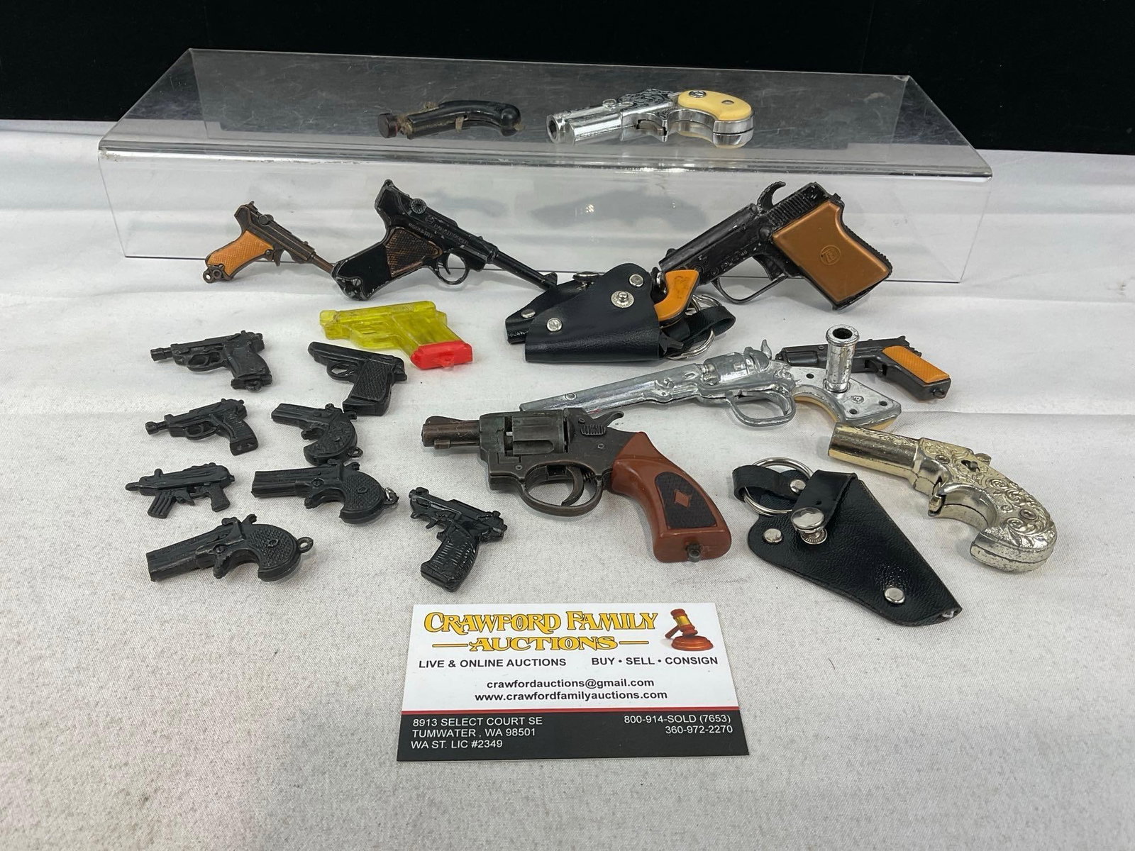 Collection of Cap Toys, & Play Action Figure Weapons, shaped like a Luger, a .38, Derringer & more: Appears to be in good shape. The small pieces fit in a box that measures approx 9h x 7w x 5d inches. See pics. E-5940