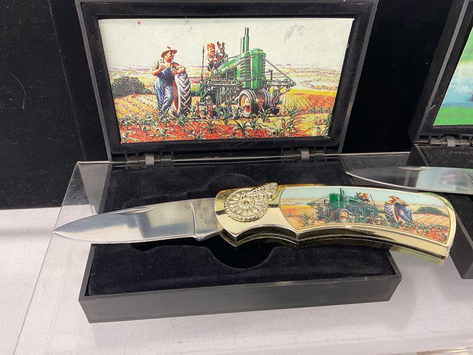 Set of 3 Commerorative Knives, Racing Scenes on 2 & John Deere Tractor, w/2 cases - 2