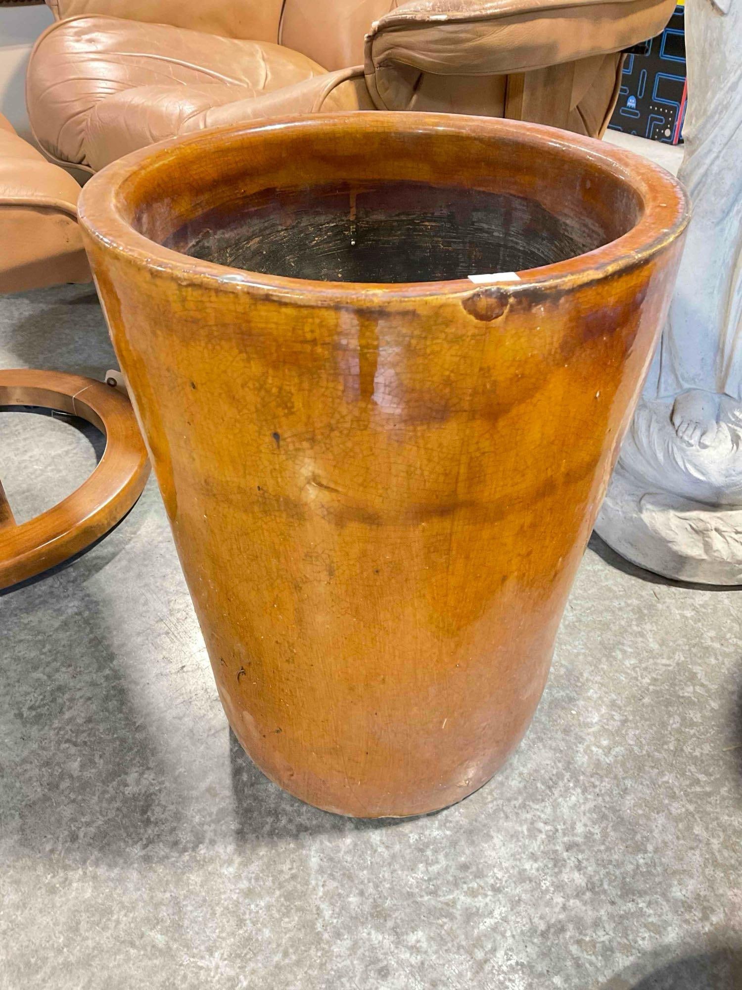 Burnt Orange Glazed Ceramic Planter Pot w/ Crazed Finish. Measures 14" x 14" x 18" See pics.: Burnt Orange Glazed Ceramic Planter Pot w/ Crazed Finish. Measures 14" x 14" x 18" Looks to have a few dings and a crack, doesn't look to run through, condition otherwise looks to be fair. DM-6130