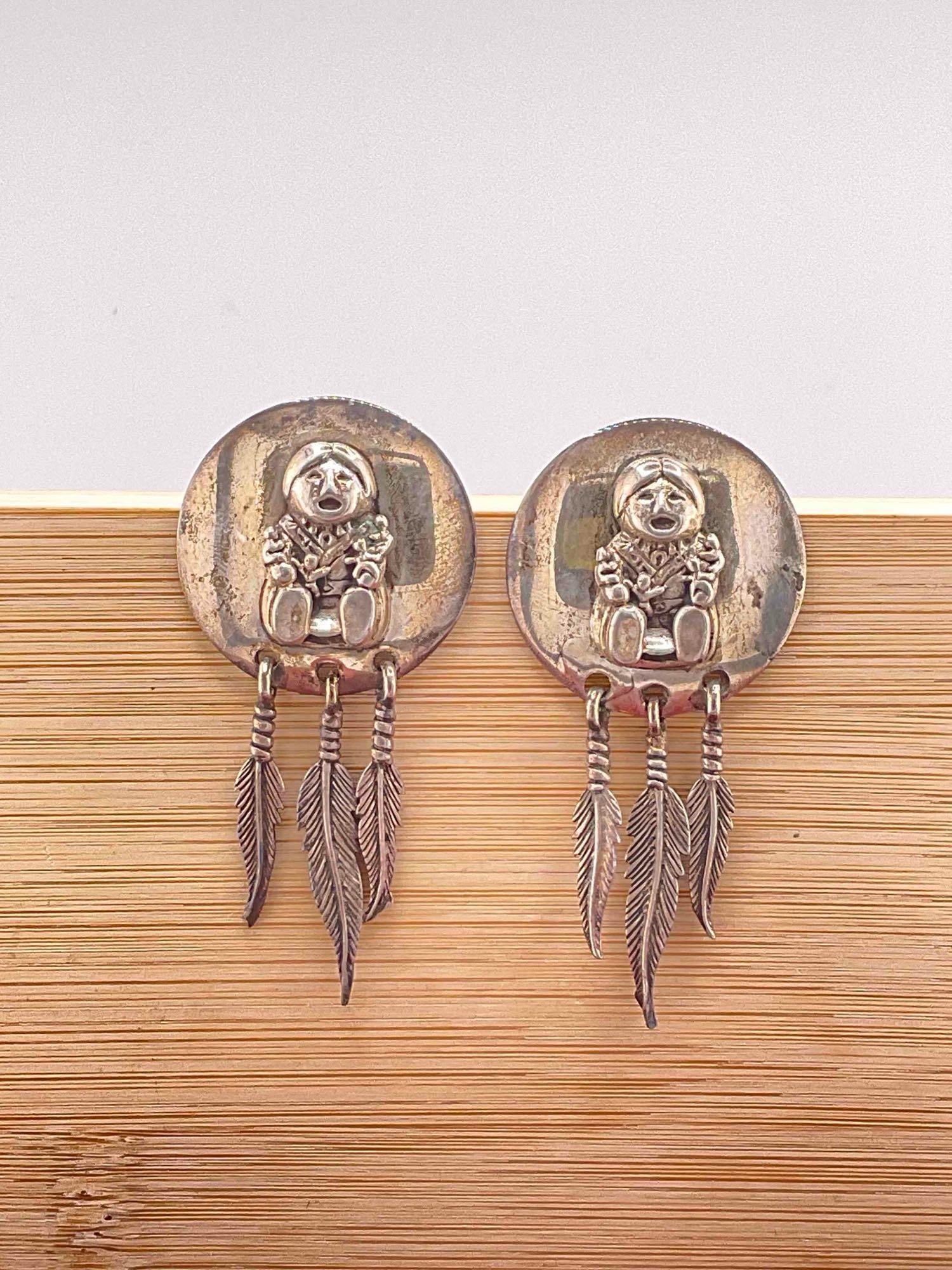 Vintage Carol Felley Sterling Silver Earrings w/ Storyteller & Dangling Feather Design. See pics.: Vintage Carol Felley Sterling Silver Earrings w/ Storyteller & Dangling Feather Design. Stamped '90 on reverse. Pair measures 26 grams. DM-414