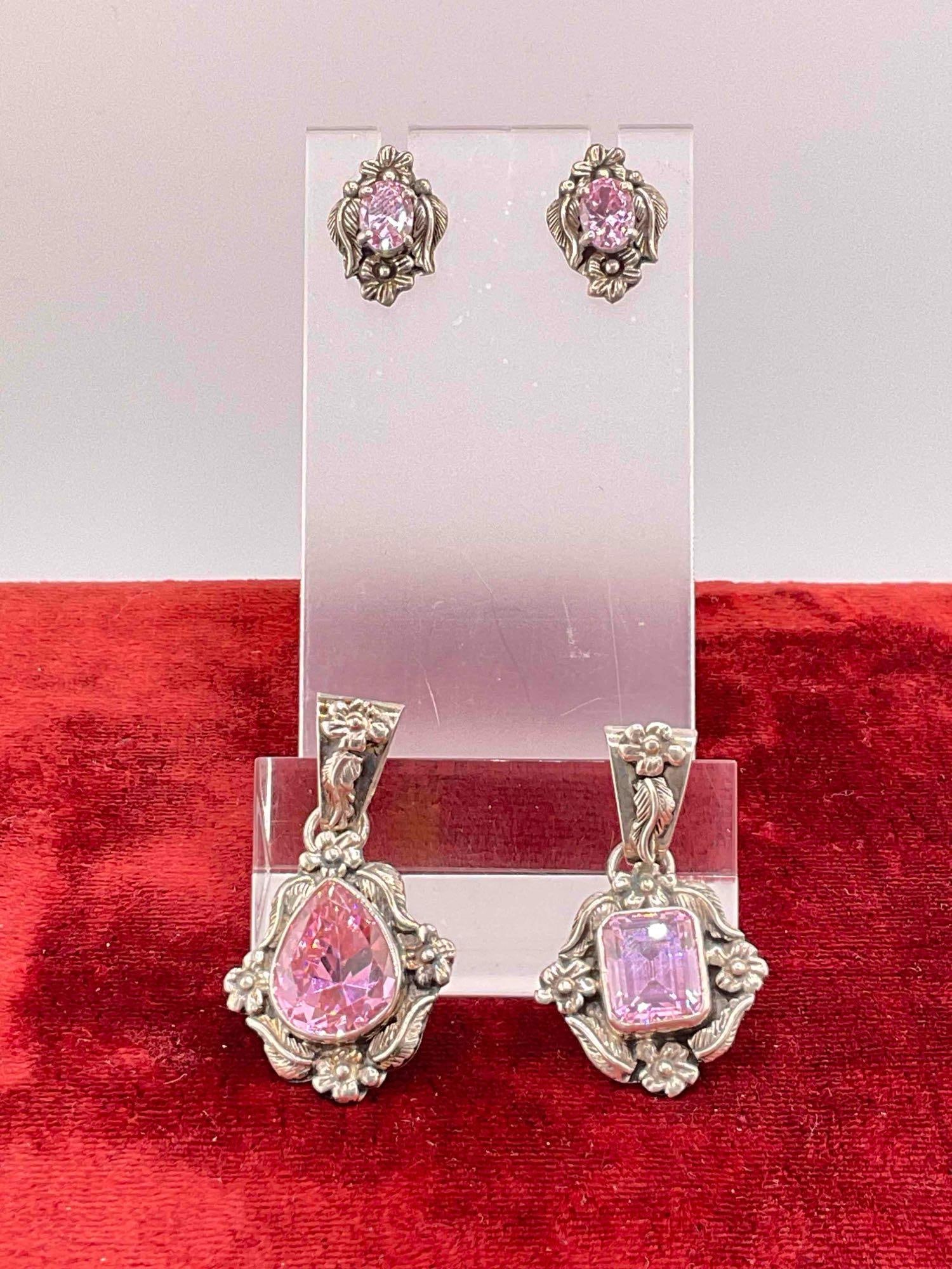 Vintage Carol Felley Sterling Silver Jewelry incl. Earrings & 2x Pendants w/ Pink CZ Toned Setting.: Vintage Carol Felley Sterling Silver Jewelry incl. Earrings & 2x Pendants w/ Pink CZ Toned Setting. Stamped 86 or 88 on reverse. Measures 24 grams altogether. CZ is Cubic Zirconia. DM-414