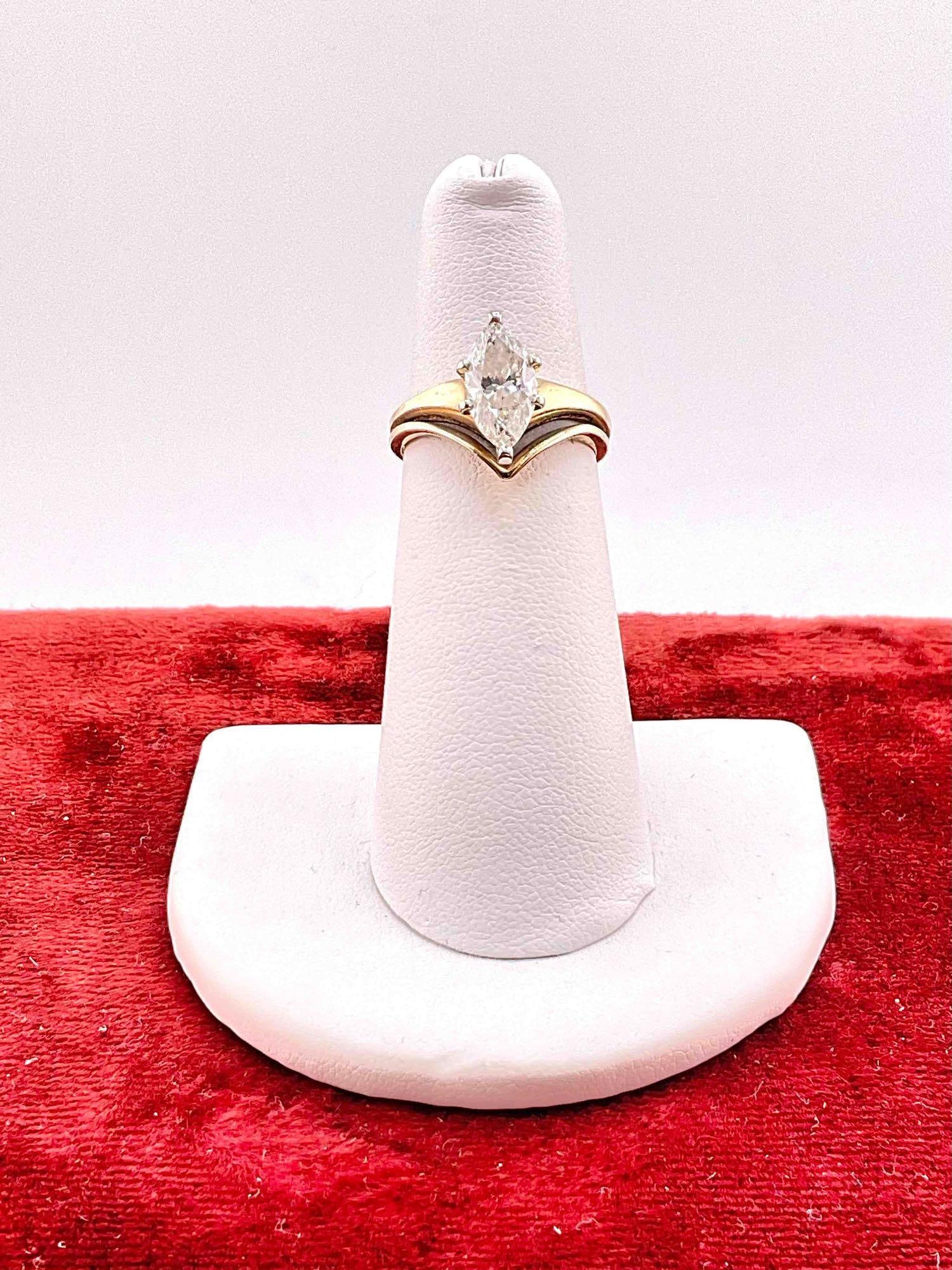 Wonens 14k GHold ring featuing a stunning 1.35 ct Marquise cut diamond Size 5 See pics: C-6110 Diamond is a SI-2, K in color had an appraisal in 1988 at 6000.00 Total weight 3.14 grams