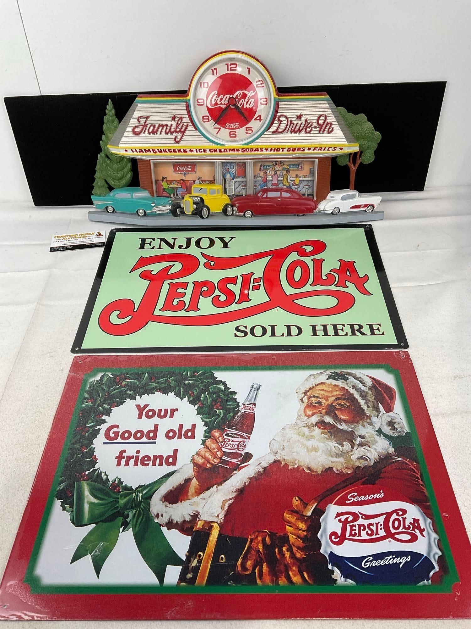 Vintage 1988 Coca-Cola Family Drive-in Diner Wall Clock, & Pair of Repro Pepsi Vintage Signs: Appears to be in good shape. The piece measures approx 14h x 21w x 3d inches. See pics. E-6120