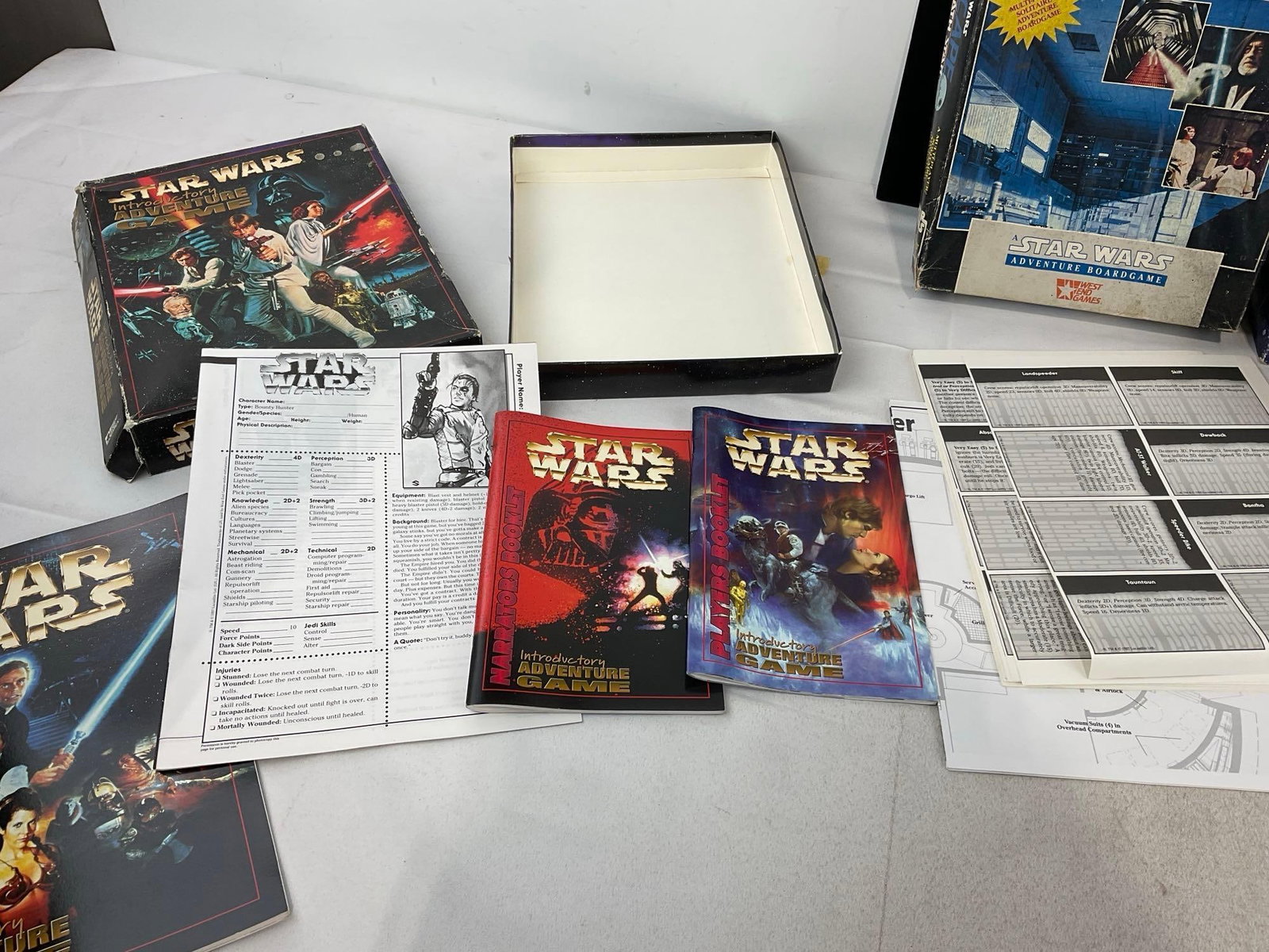 Pair of Star Wars Adventure Board Games, Pair of Star Trek DS9 Mugs in box, & 2019 Lightsaber Toy - 3