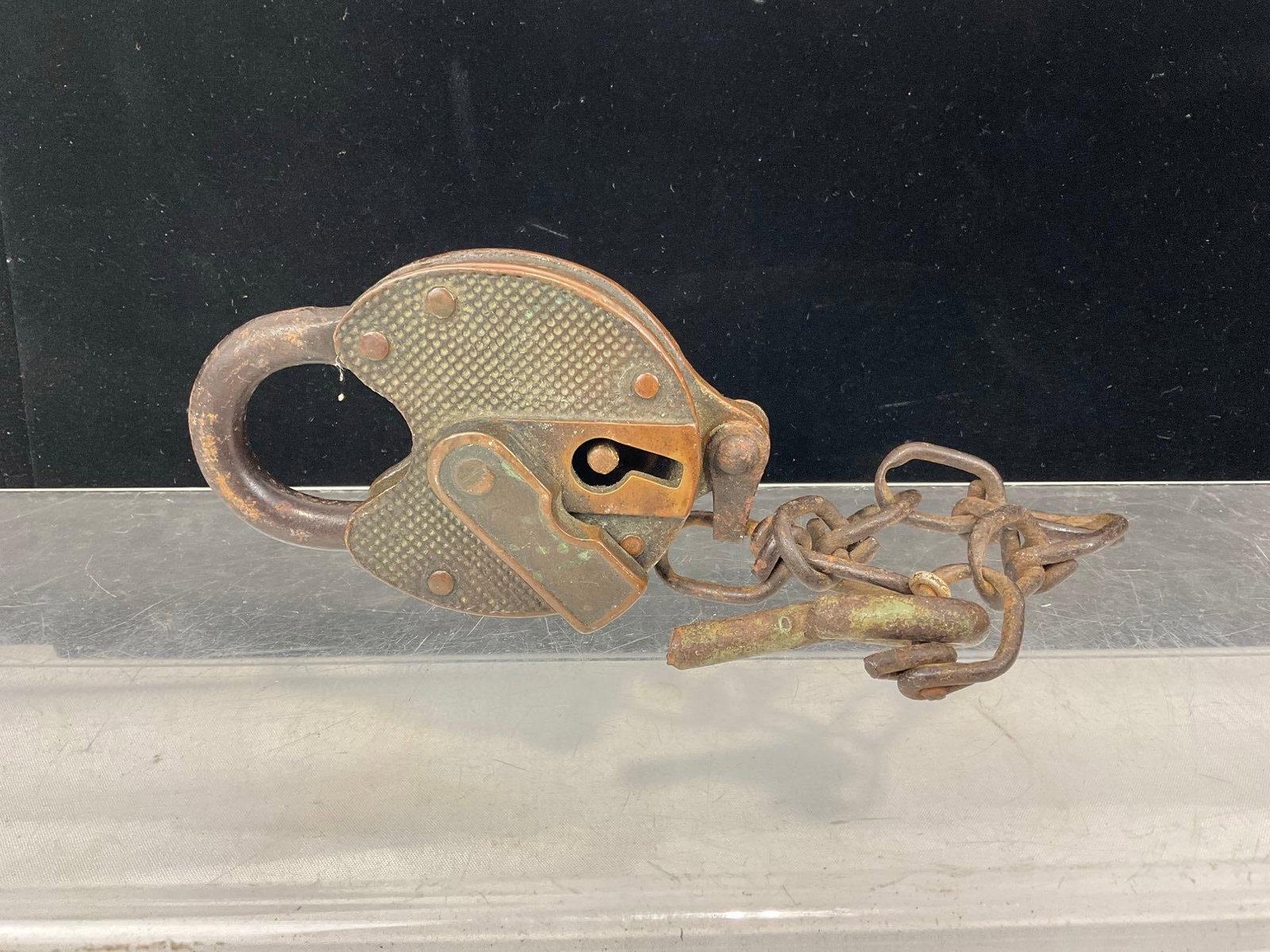 Antique Cast Metal Miller Lock, no key, dimpled surface, w/chain: Appears to be in fair to good shape. The piece measures approx 6h x 4w x 3d inches. See pics. E-6030