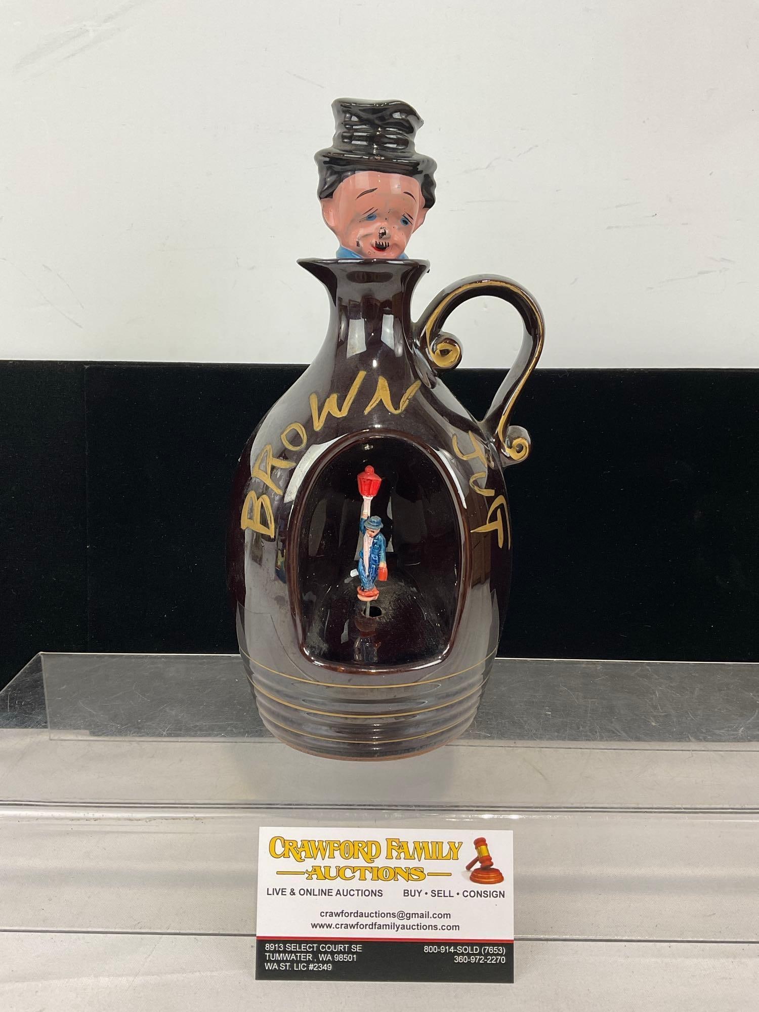 Little Brown Jug Music Decanter, Japan, needs some TLC, loose bottom: Appears to be in good shape, the bottom is loose, makes noise as is. The piece measures approx 11h x 6w x 5d inches. See pics. E-6030