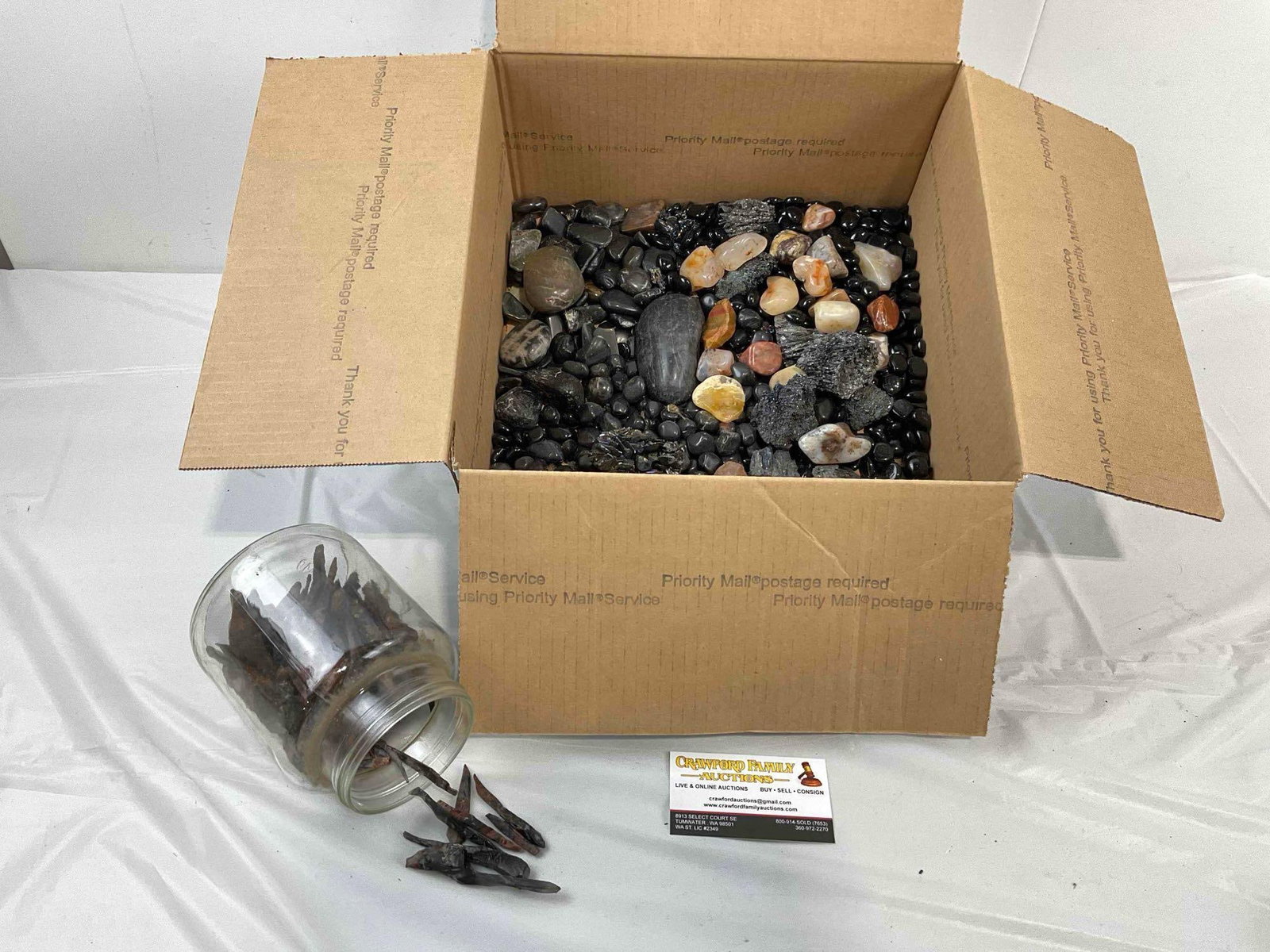 Uncounted Assortment of Loose River Rocks, Black Glass Stones, Mahogany Obsidian Needles.: Uncounted Assortment of Loose River Rocks, Black Glass Stones, Mahogany Obsidian Needles. Also contains what could be carborundum? Interesting selection. Fits in box measuring 12" x 12" x 6" Dm-6030