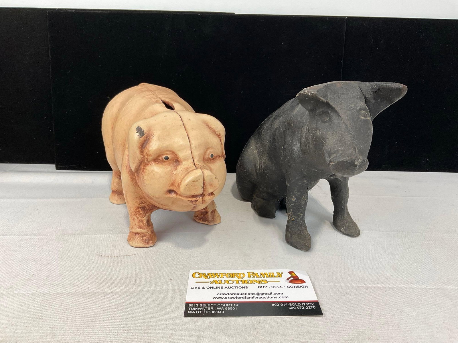 Pair of Cast Iron Pig Coin Banks, 1 Pink finish, and 1 unfinished, possible repros: Appears to be in good shape. The piece measures approx 7h x 10w x 9d inches. See pics. E-6160