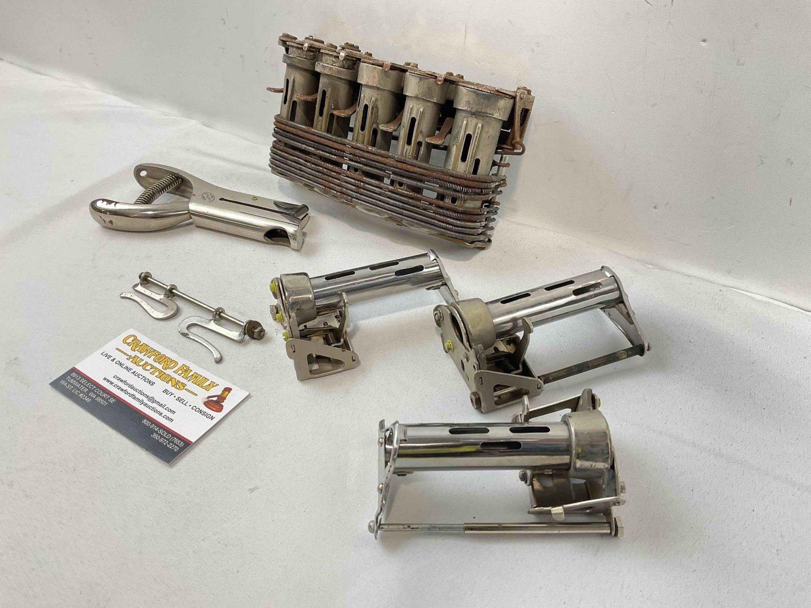 5 pcs Vintage Tools, incl. Hole Punch & 4x Coin Changers, incl. McGill High Speed Changer. - 2