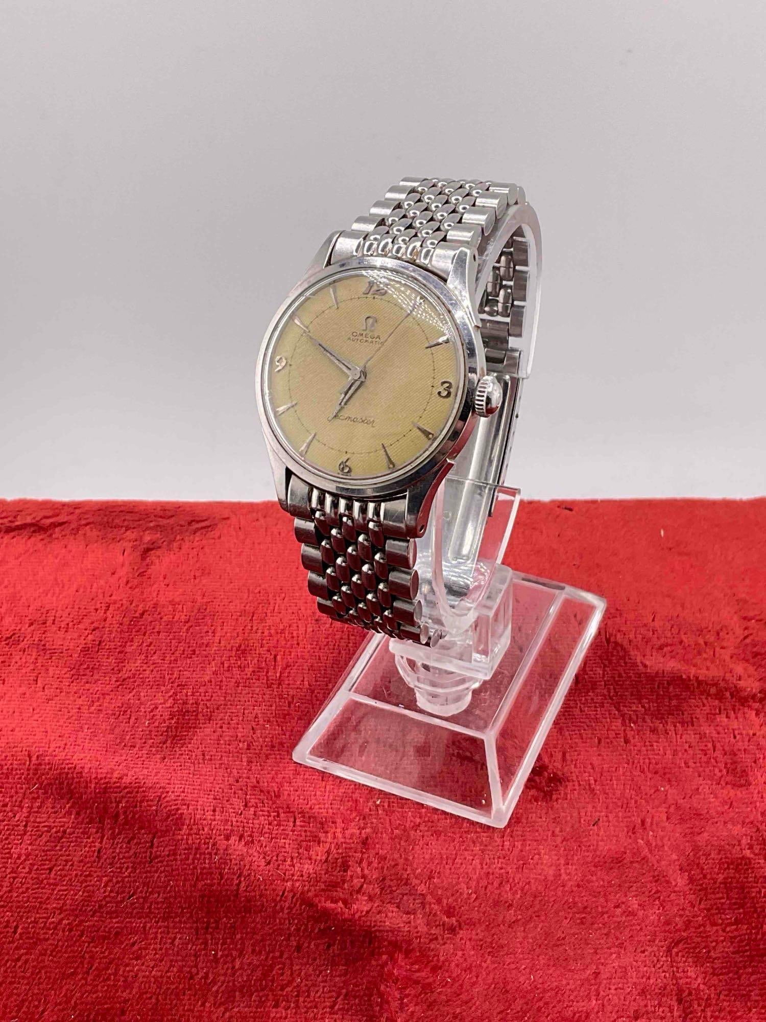 Vintage circa 1950's Omega Seamaster Bumper? Men's Watch w/ stainless steel case & band. see pics: C-6080 Watch is vintage, will run then stops, needs service, crystal has scratches. sold as -is 