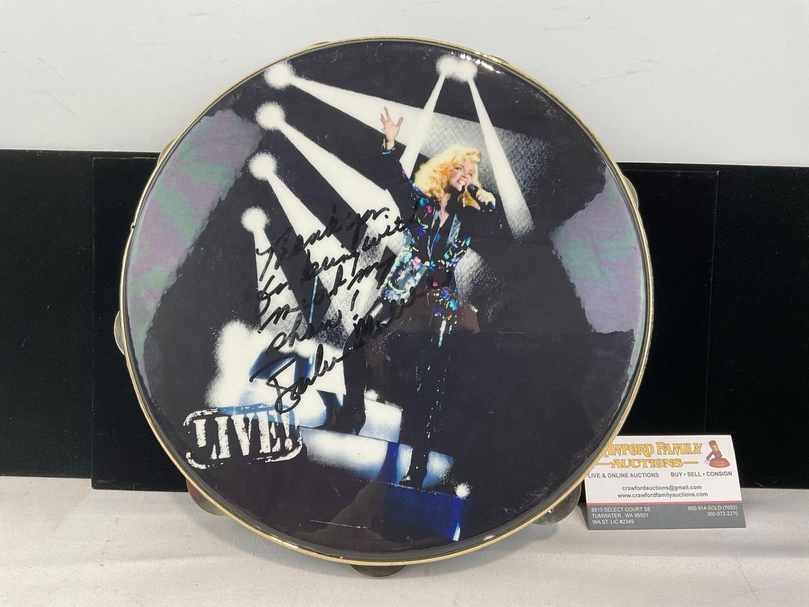 Signed Barbara Mandrell Tambourine w/message, picture from live concert on front, 3x12x12 inches: This from the collection of the late owner of a Collection Store. Personalized : Thank you for being with me at my show! - Barbara Mandrell. Appears to be in good shape. The piece measures approx 3h