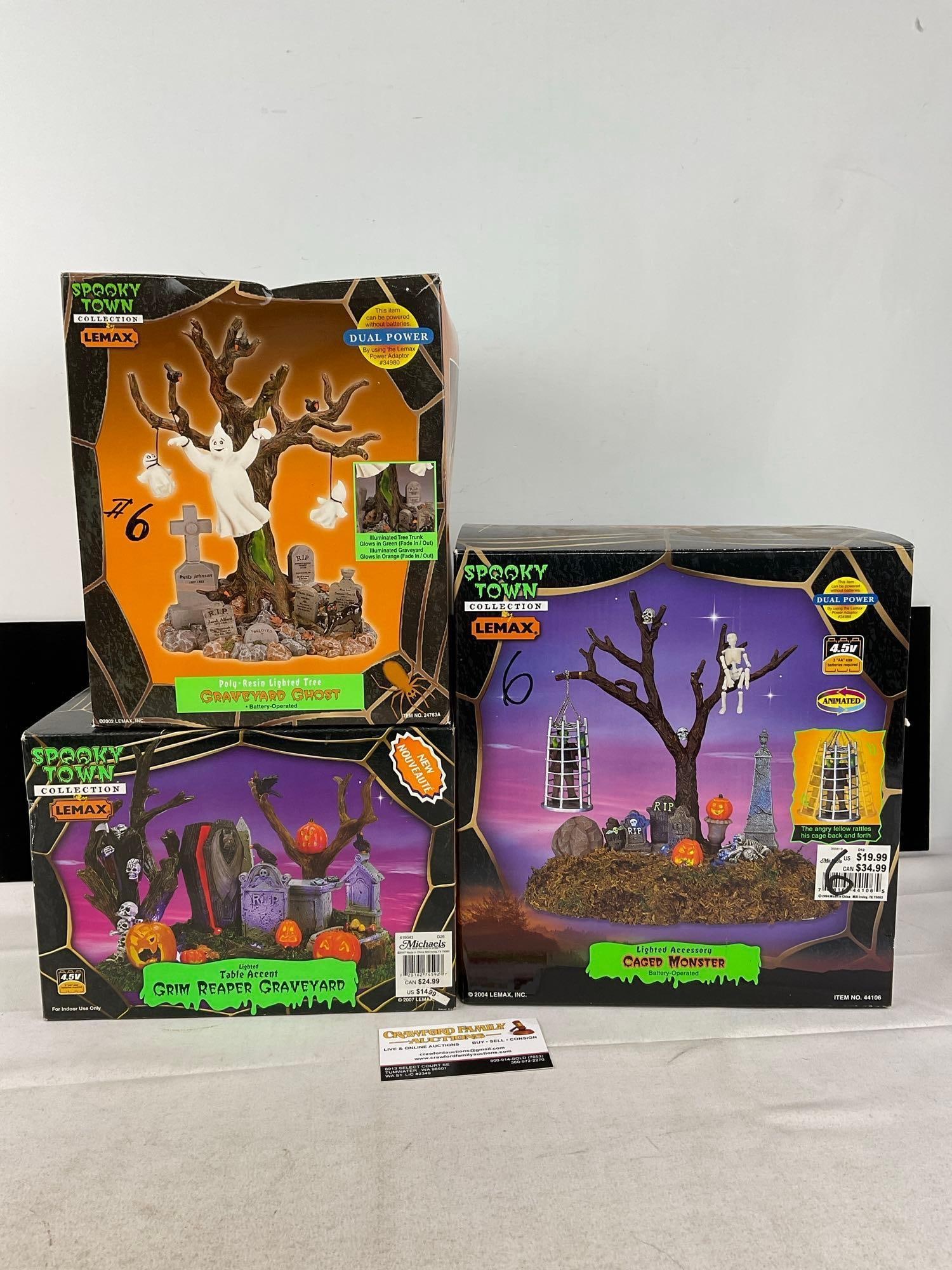 Lemax Spooky Town Halloween pieces in box, Graveyard Ghost, Grim Reaper Graveyard, & Caged Monster: Appears to be in good shape. The piece measures approx 16h x 14w x 11d inches. See pics. E-6160