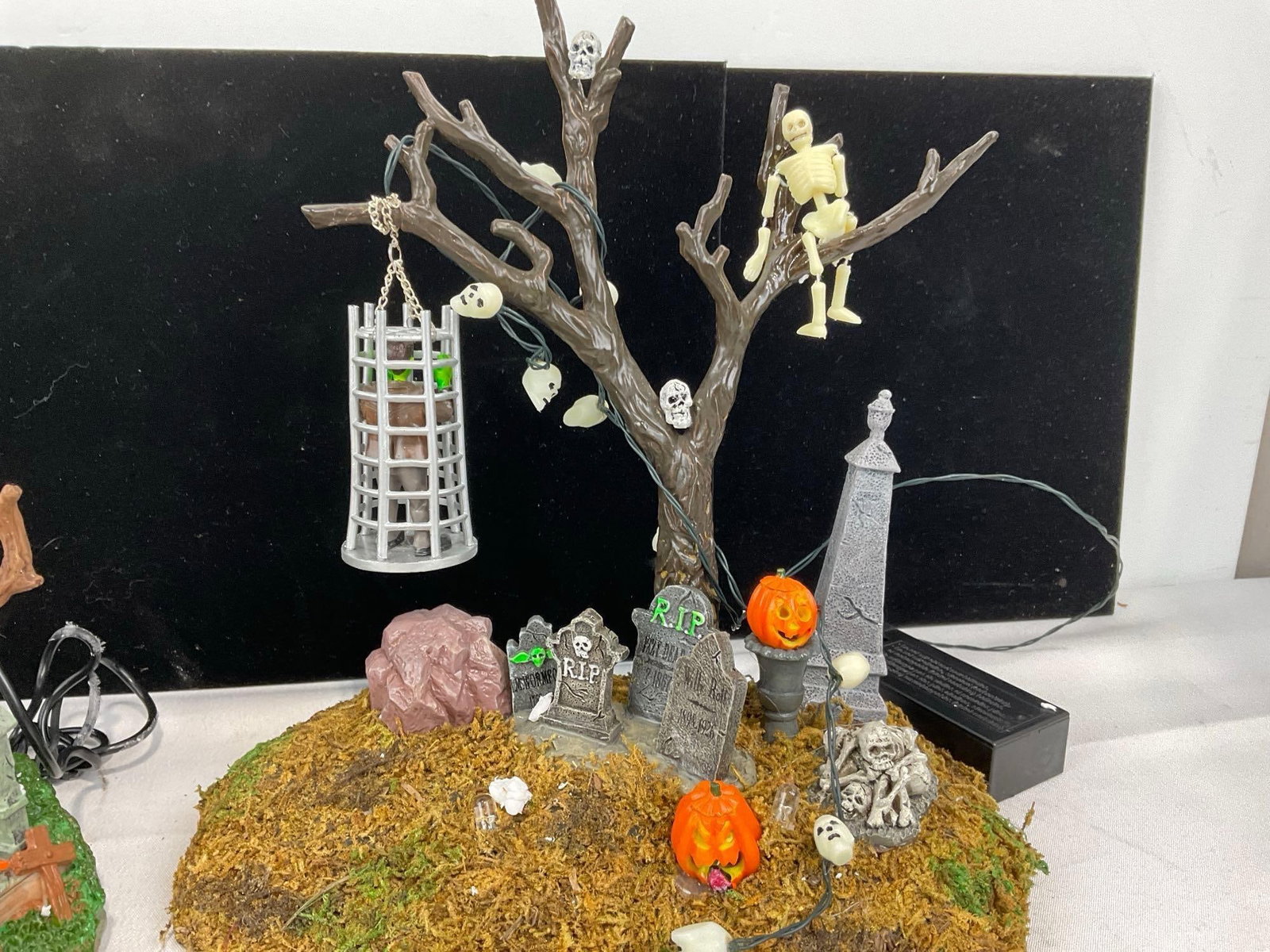 Lemax Spooky Town Halloween pieces in box, Graveyard Ghost, Grim Reaper Graveyard, & Caged Monster - 6